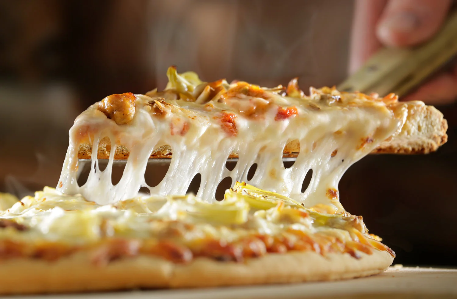 ChicagoFoodPhotographerPizzaCheesePull.jpg
