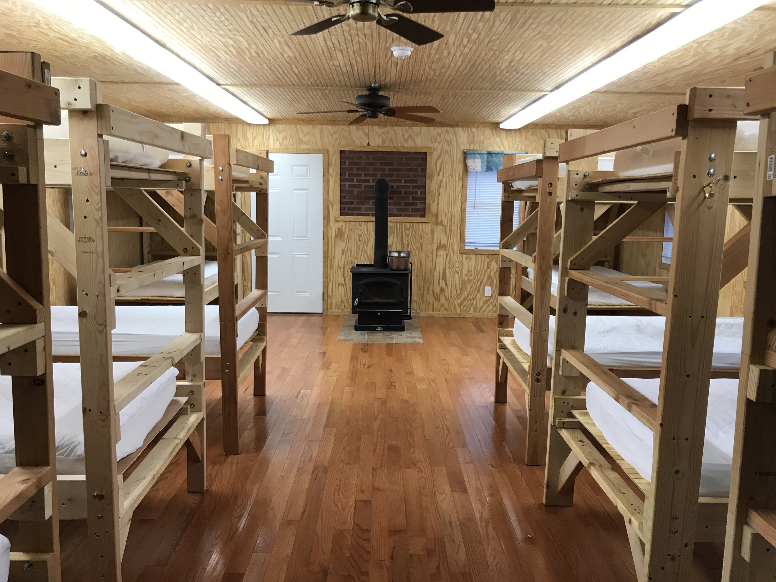 One of the bunkhouses featuring a warm wood stove. 
