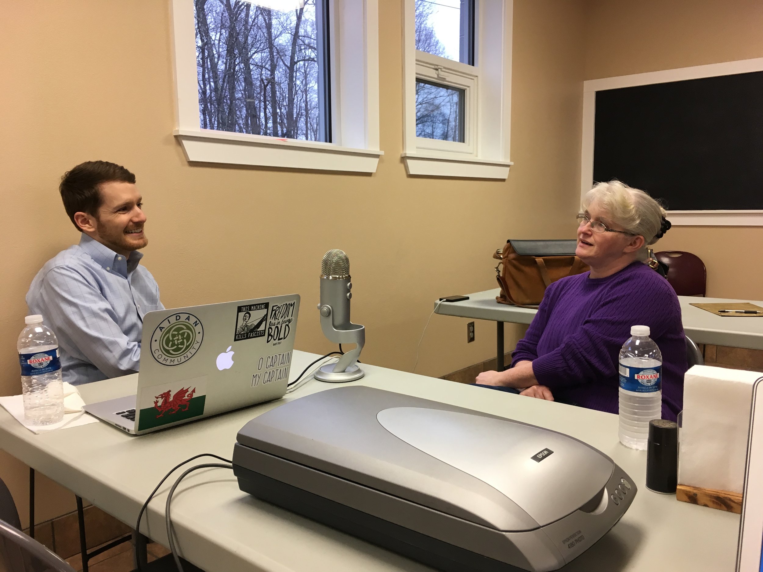 Anita Boyd, Executive Director of Grace House, being interviewed by Canon Connor Gwin.