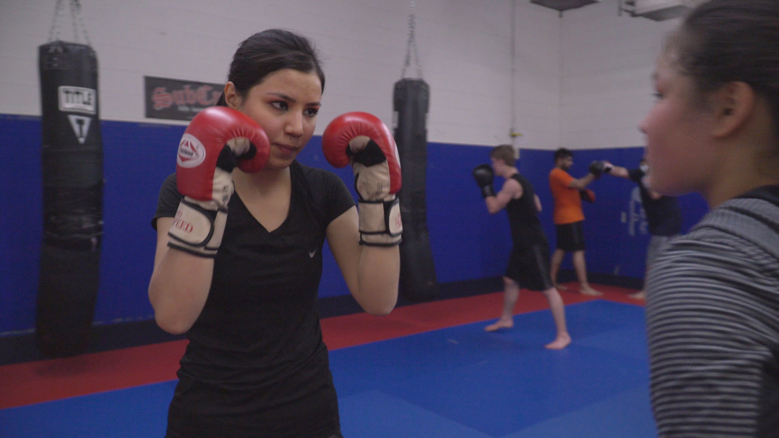 Sorayya at boxing class with her sister, Samira.