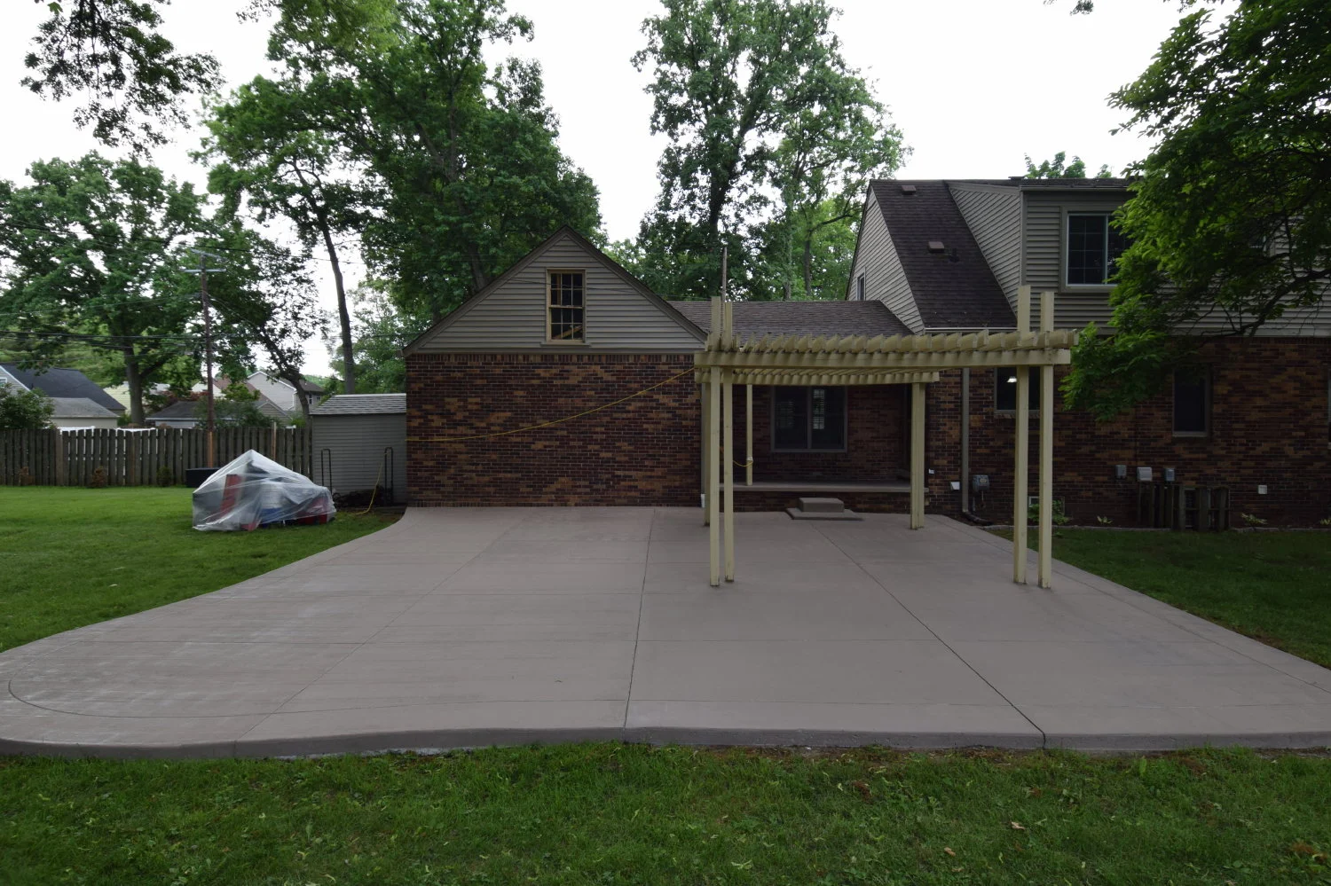 Concrete Patio With Integrally-Colored Thin Cement Overlay Being Applied