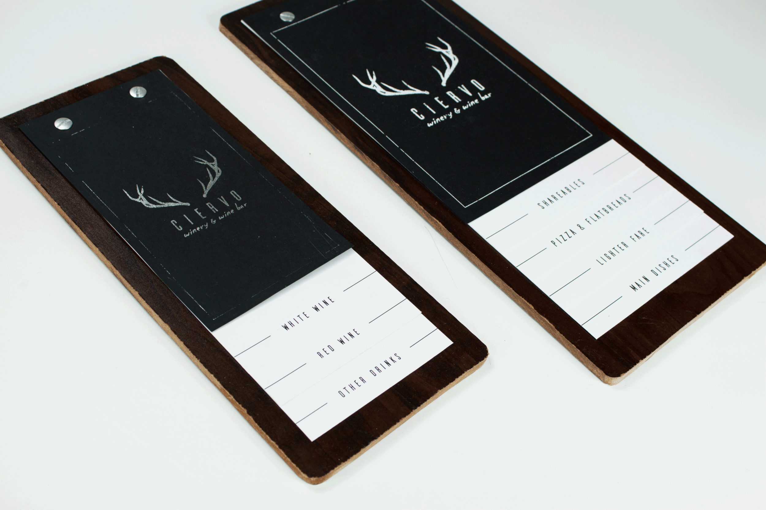 The Food and Drink menus are mounted on thin wooden boards with metal hardware to keep the menus light in the hands, but also compliment the industrial aesthetic.