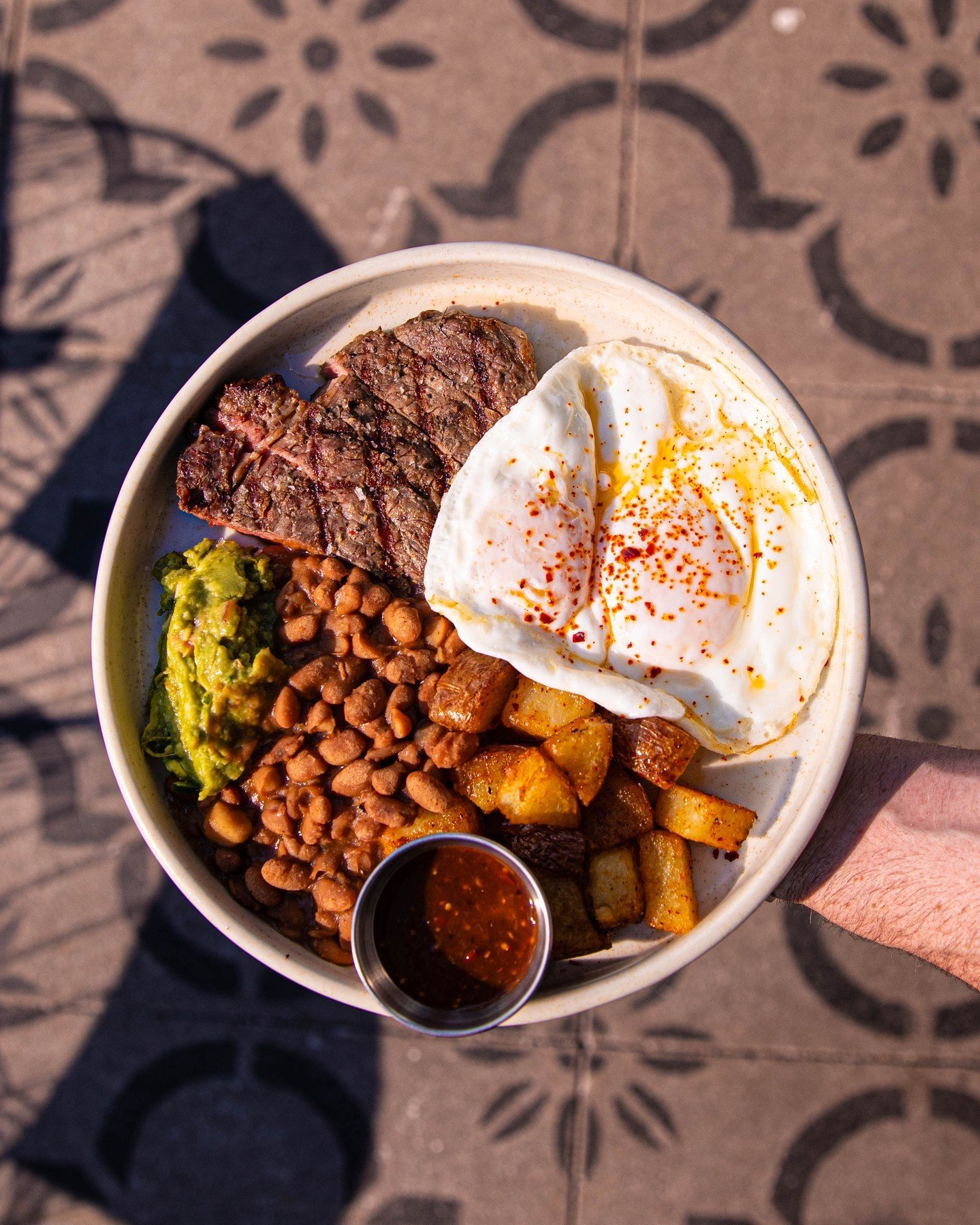 Steak, eggs, guac, beans, and potatoes... What more could you ask for on a brunch plate?