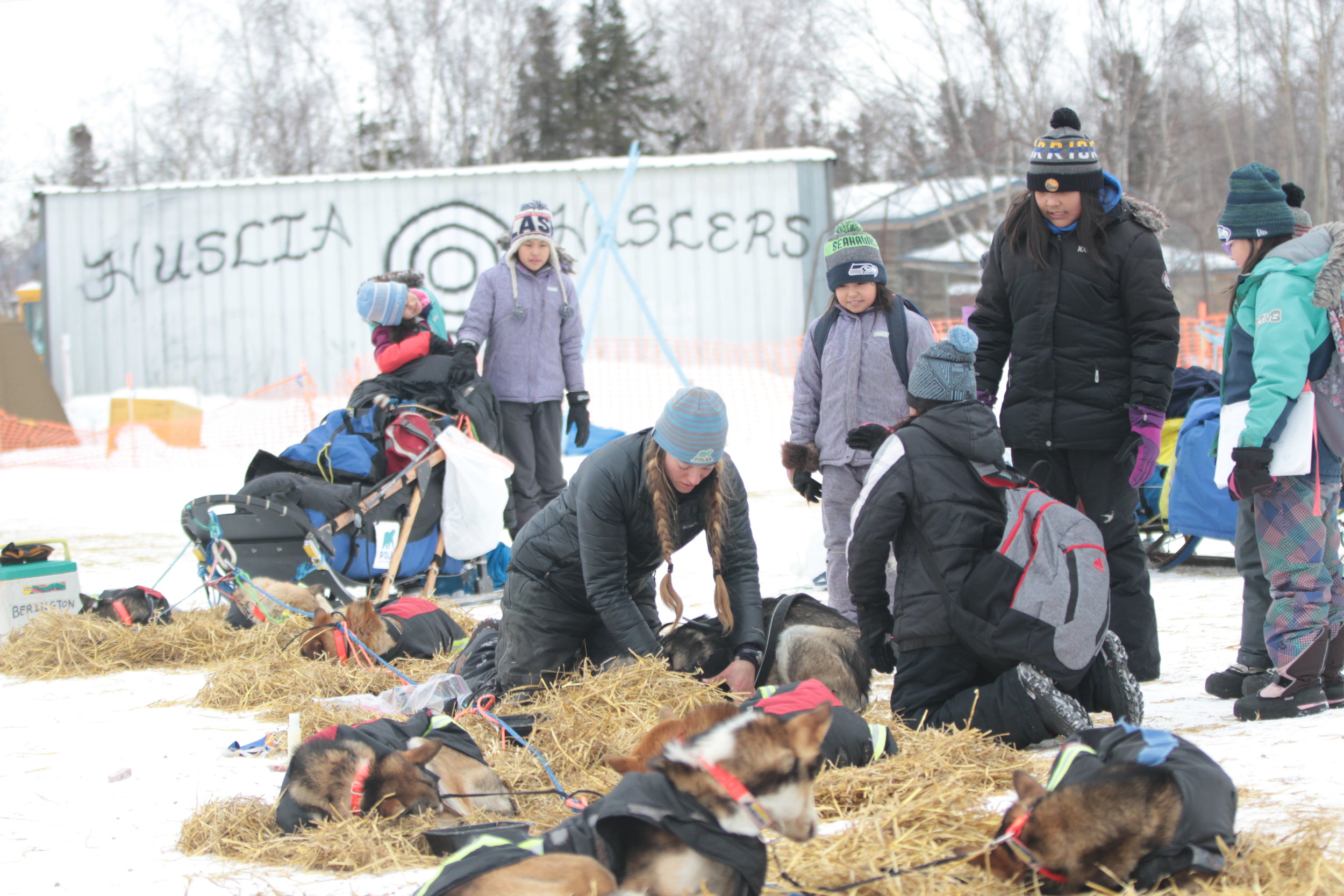 Huslia students talk with Iditarod Racers while stopping at this Checkpoint, March 2017