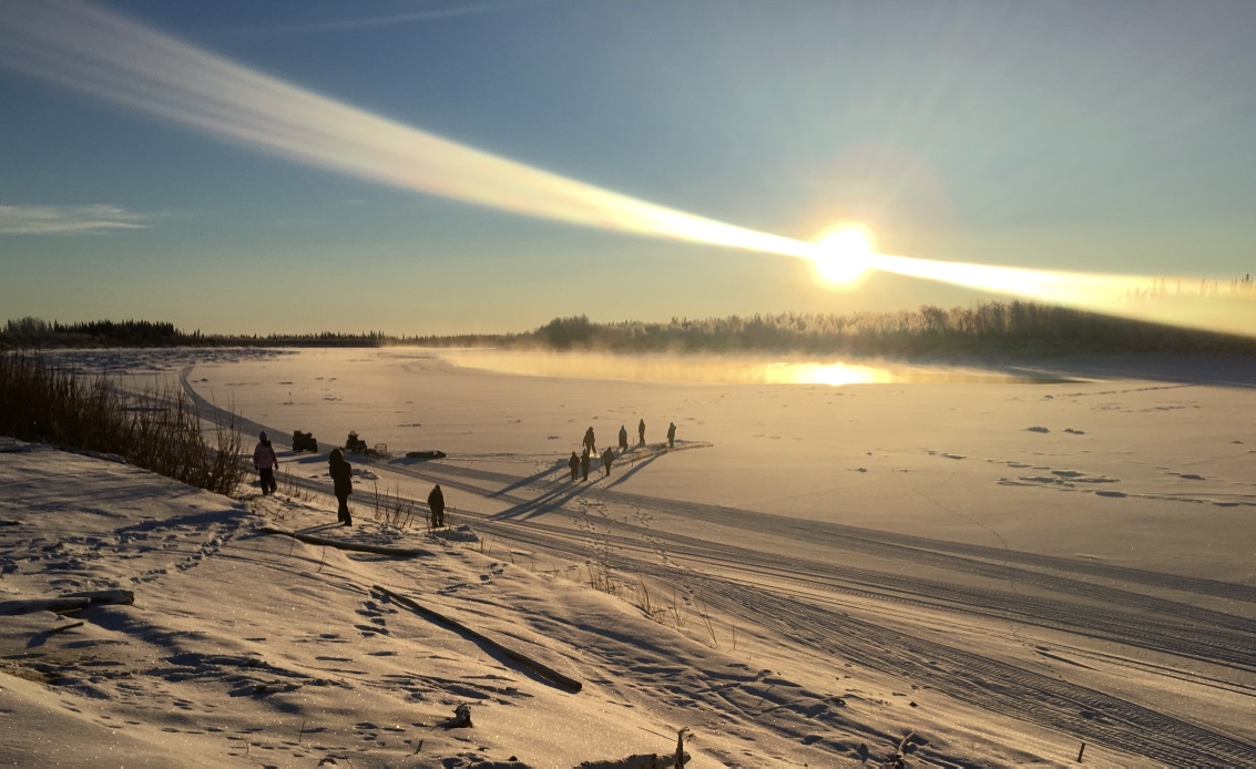 Huslia JHS students learn to set fish net in ice of the Koyukuk River.