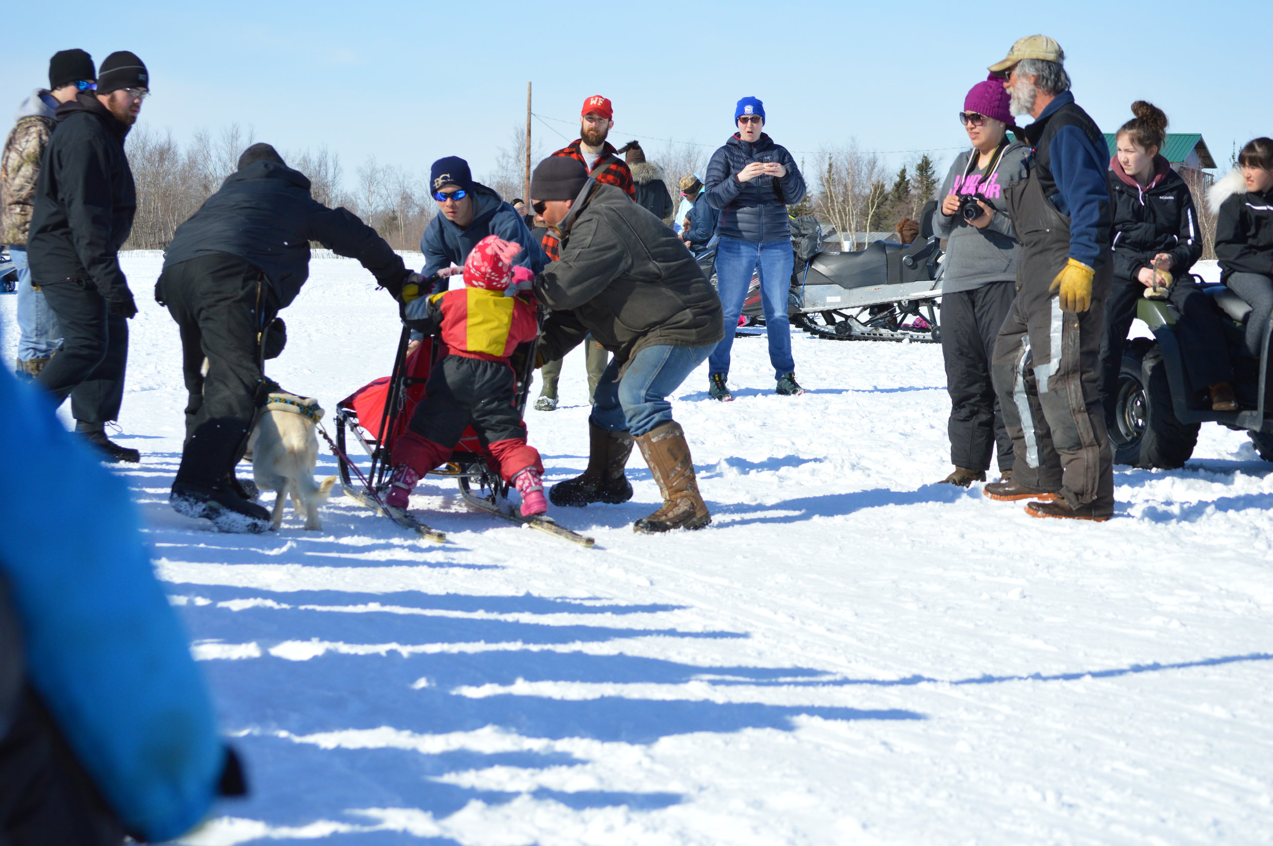 Huslia Jr. Carnival - One-dog racer at Finish Line.