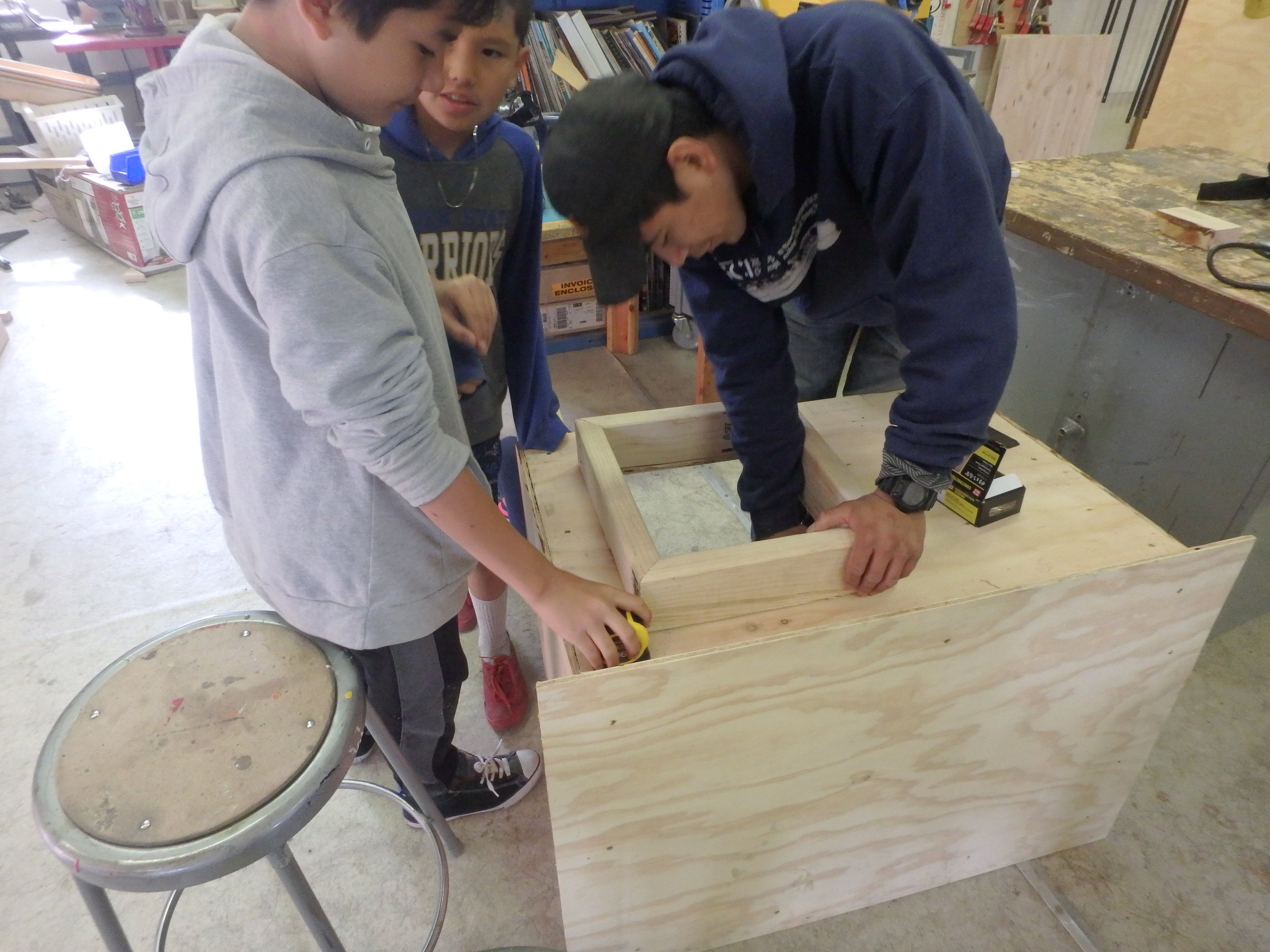 Minto School students learn to build a dog box.