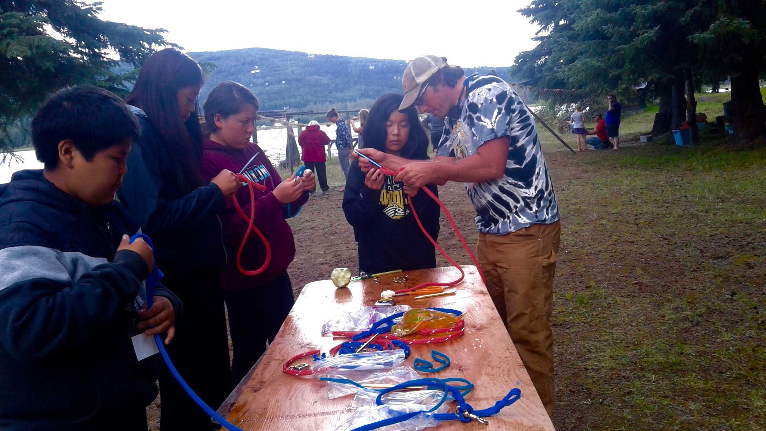 Dog musher teacher shows students how to make lines.