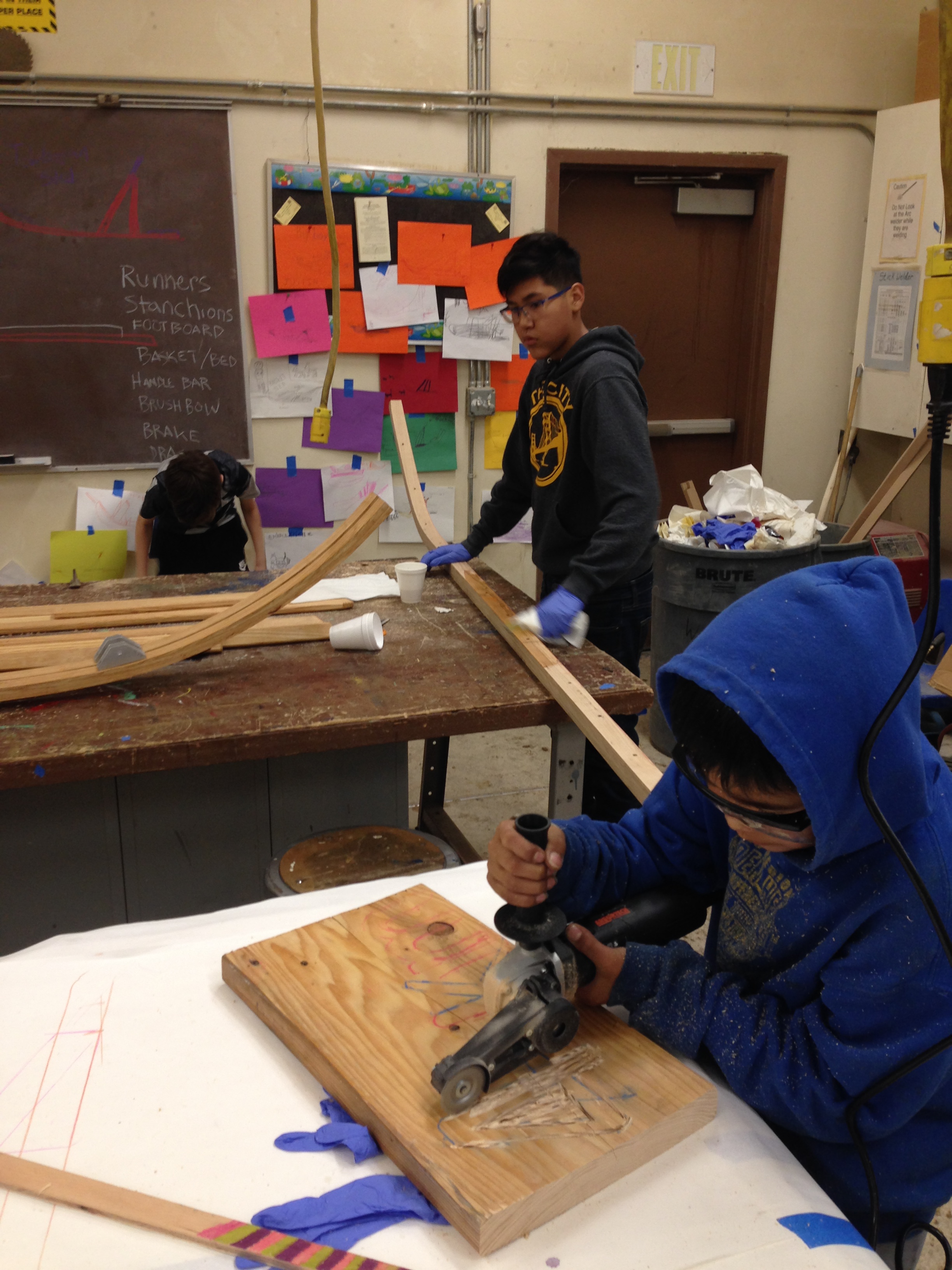 Students prepping sled runners.