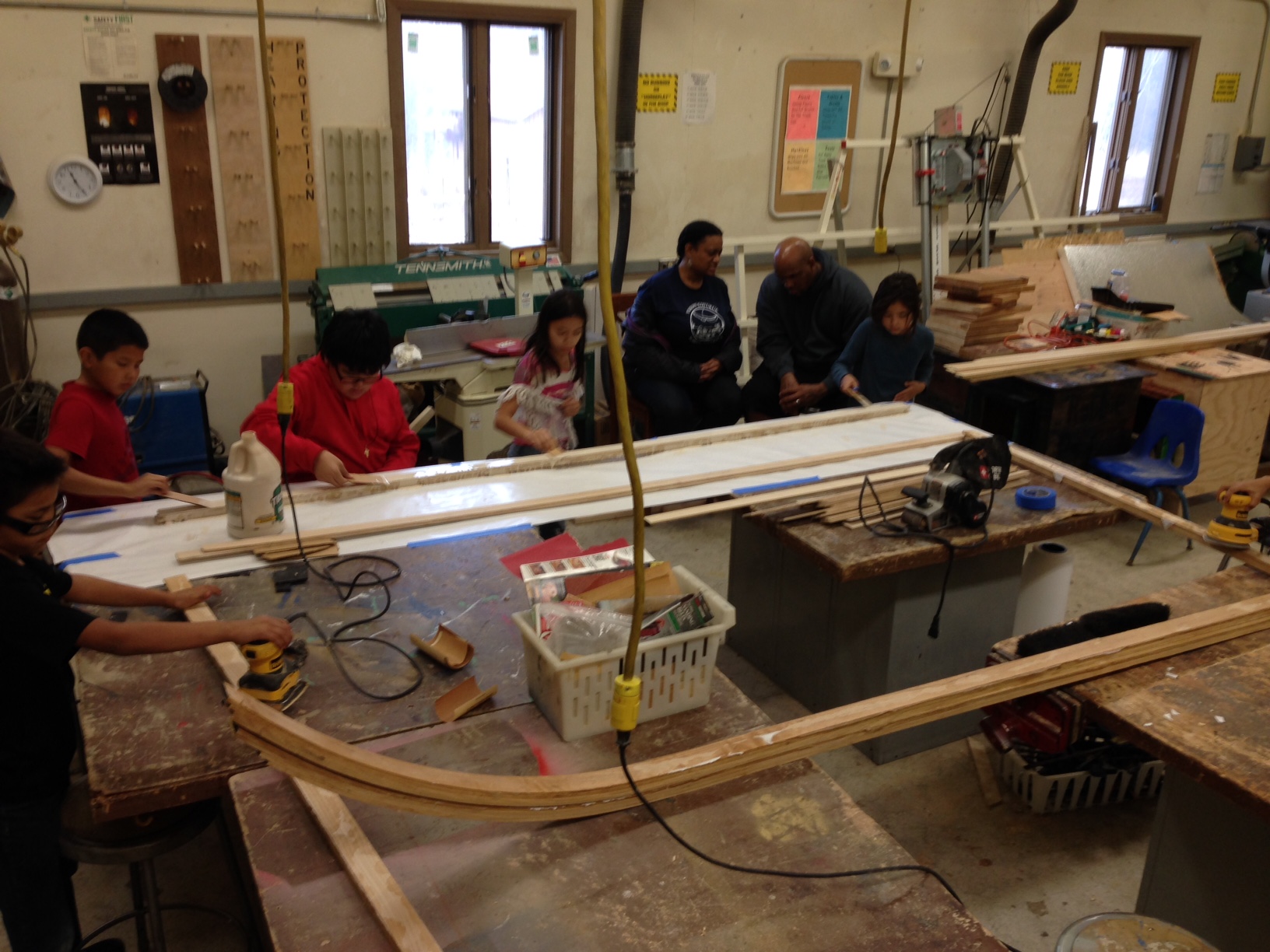 Students work with plastic for sled .