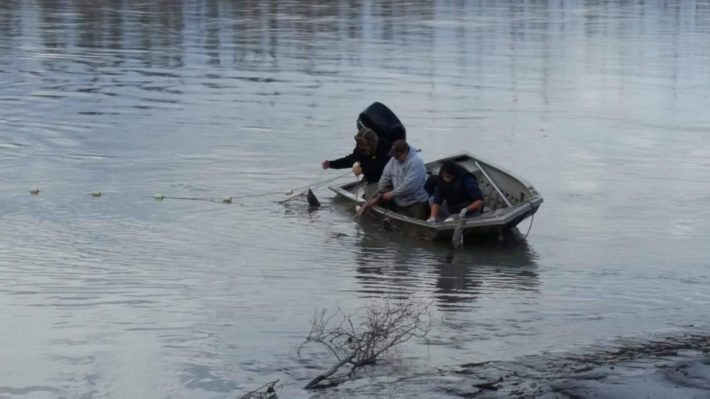 Students in boat catching salmon in Tanacross.