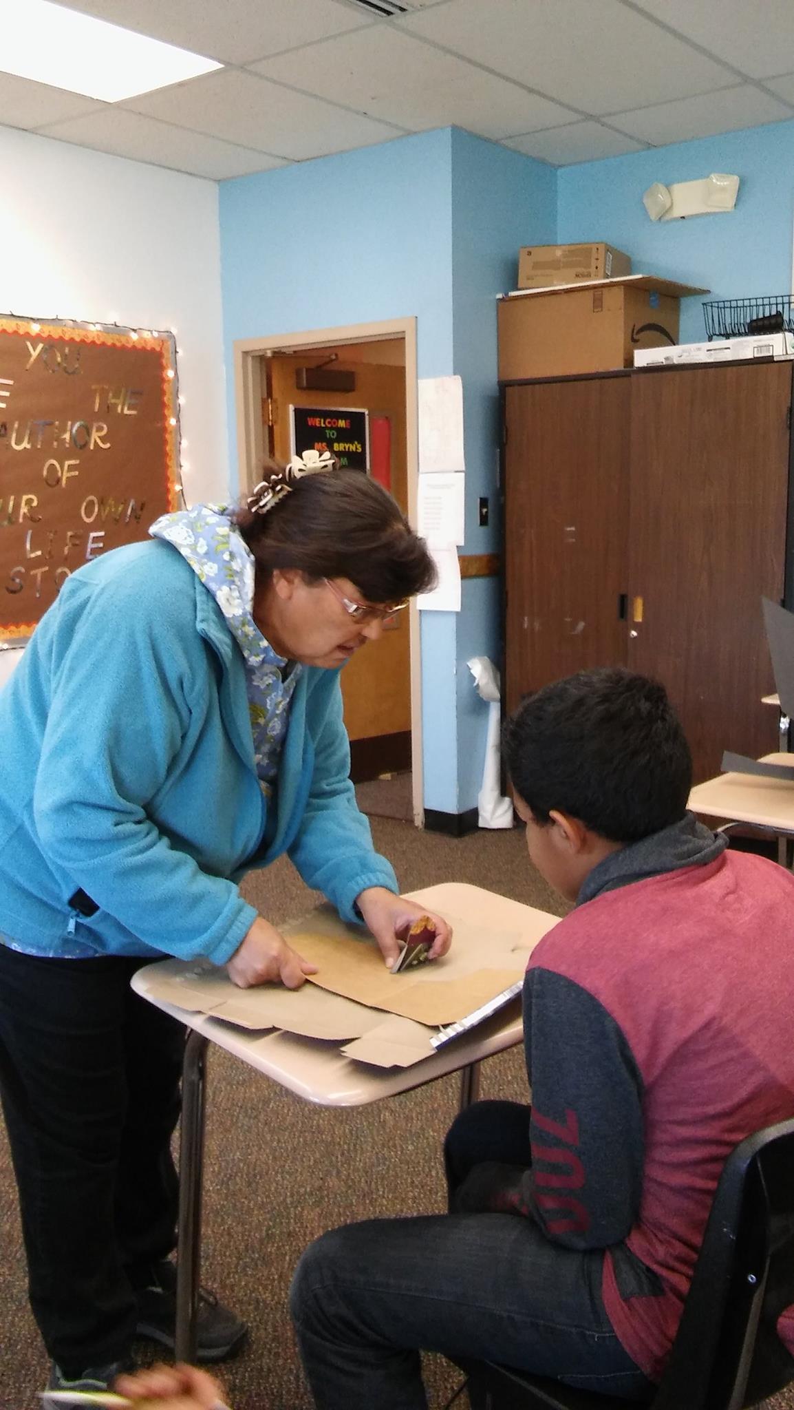 Local Culture Expert teaching students learn how to work with moose hide