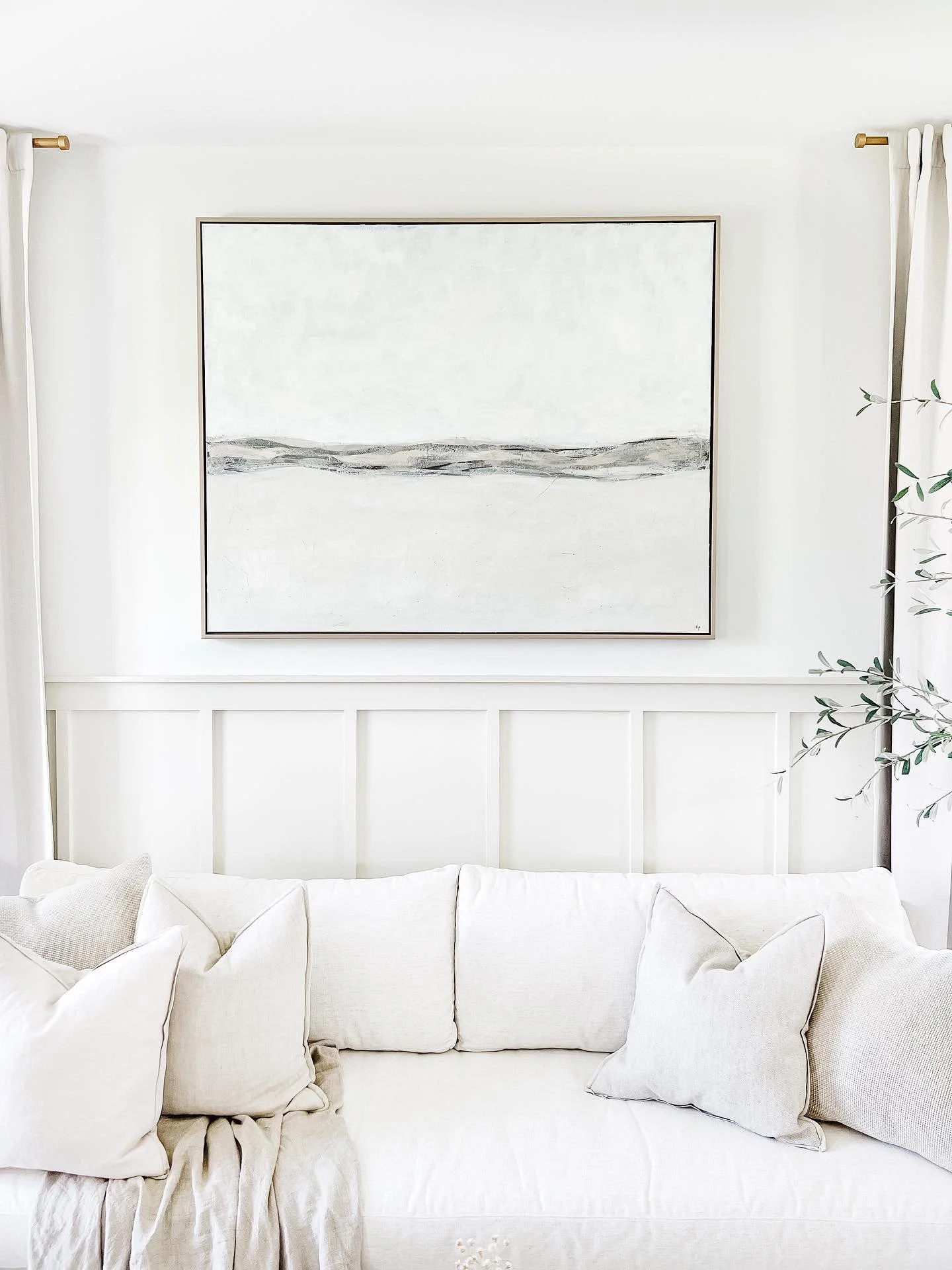 large wall art in a coastal home with neutral colors