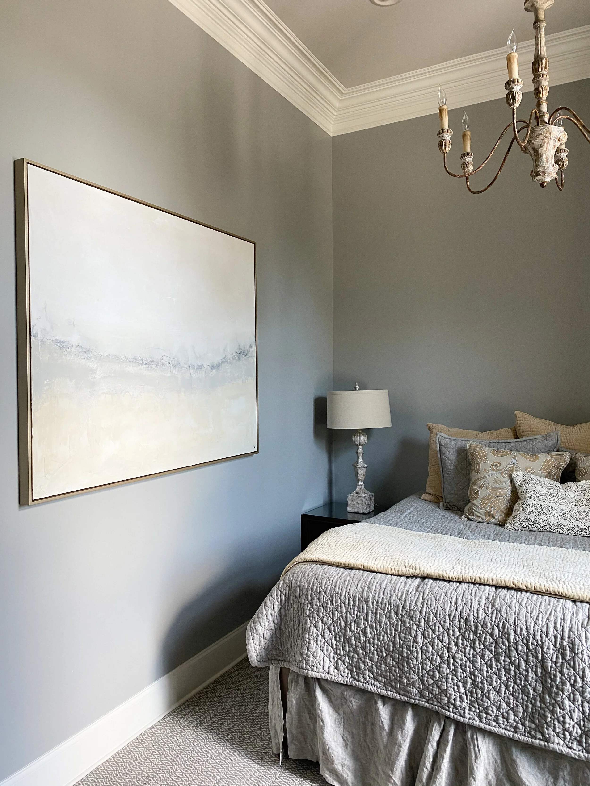 Abstract grey, blue, and cream wall art.