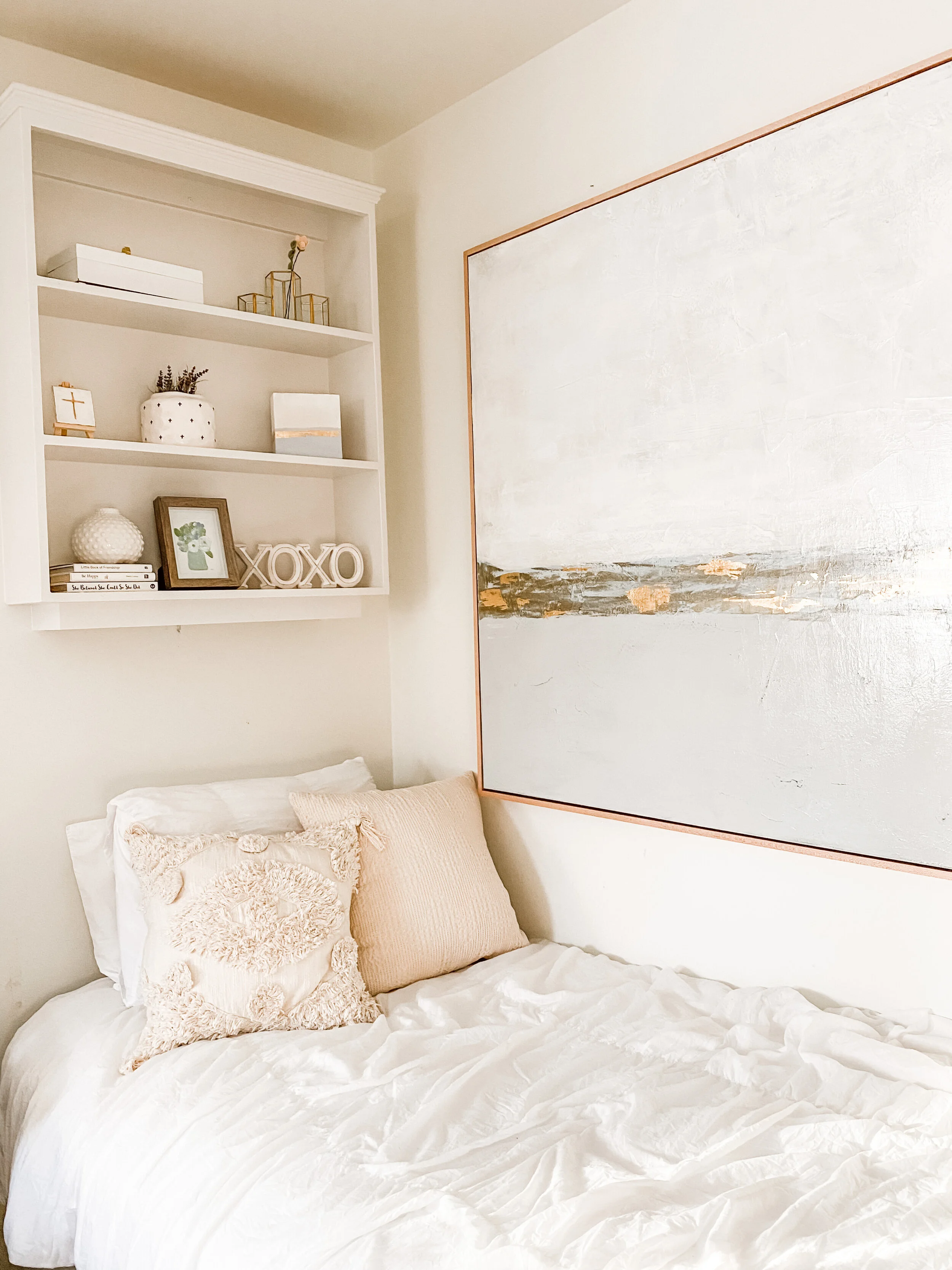 Large abstract painting in muted soft colors and neutral tones.