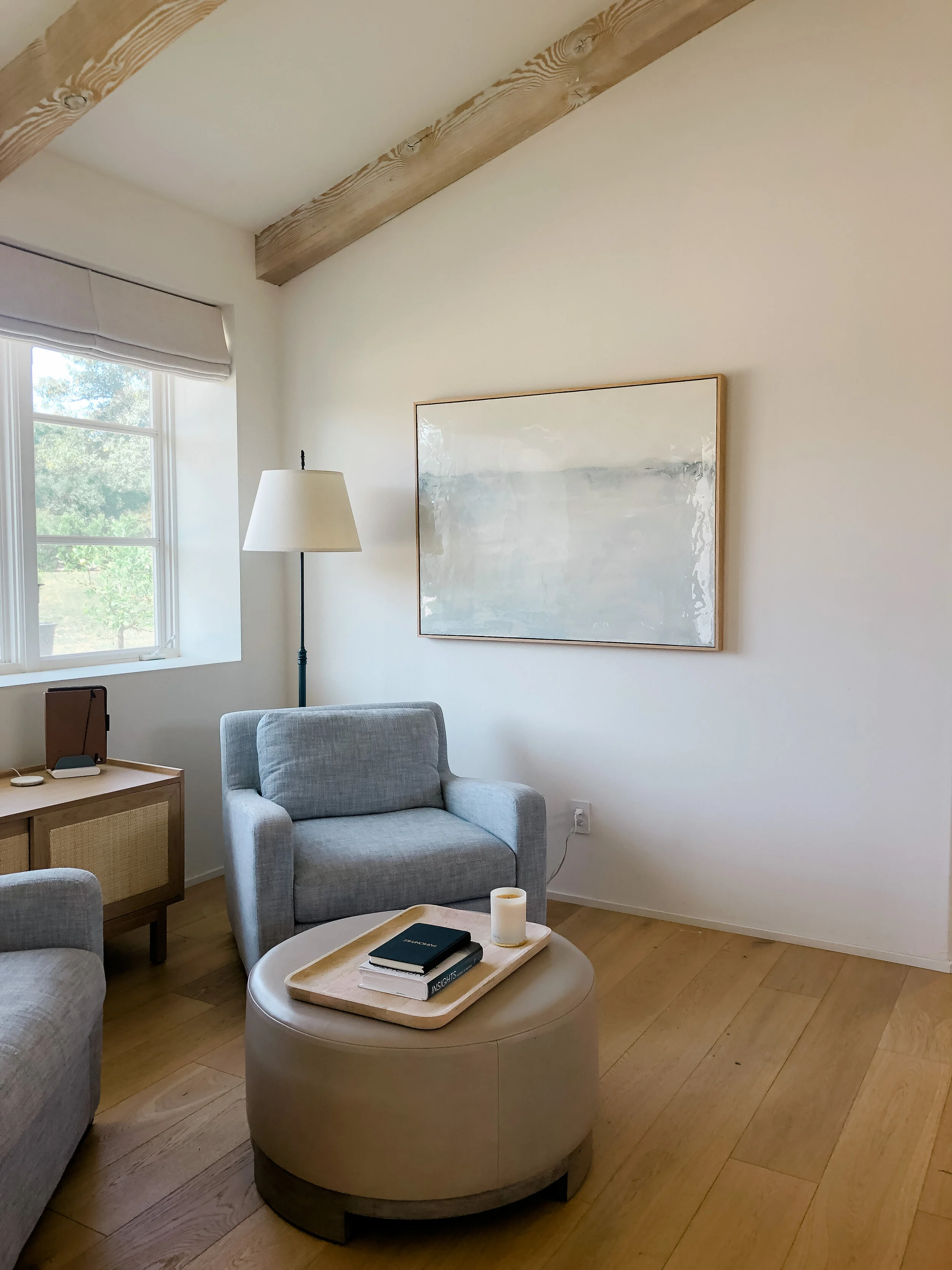 Abstract art for interior design hangs in a dining room.