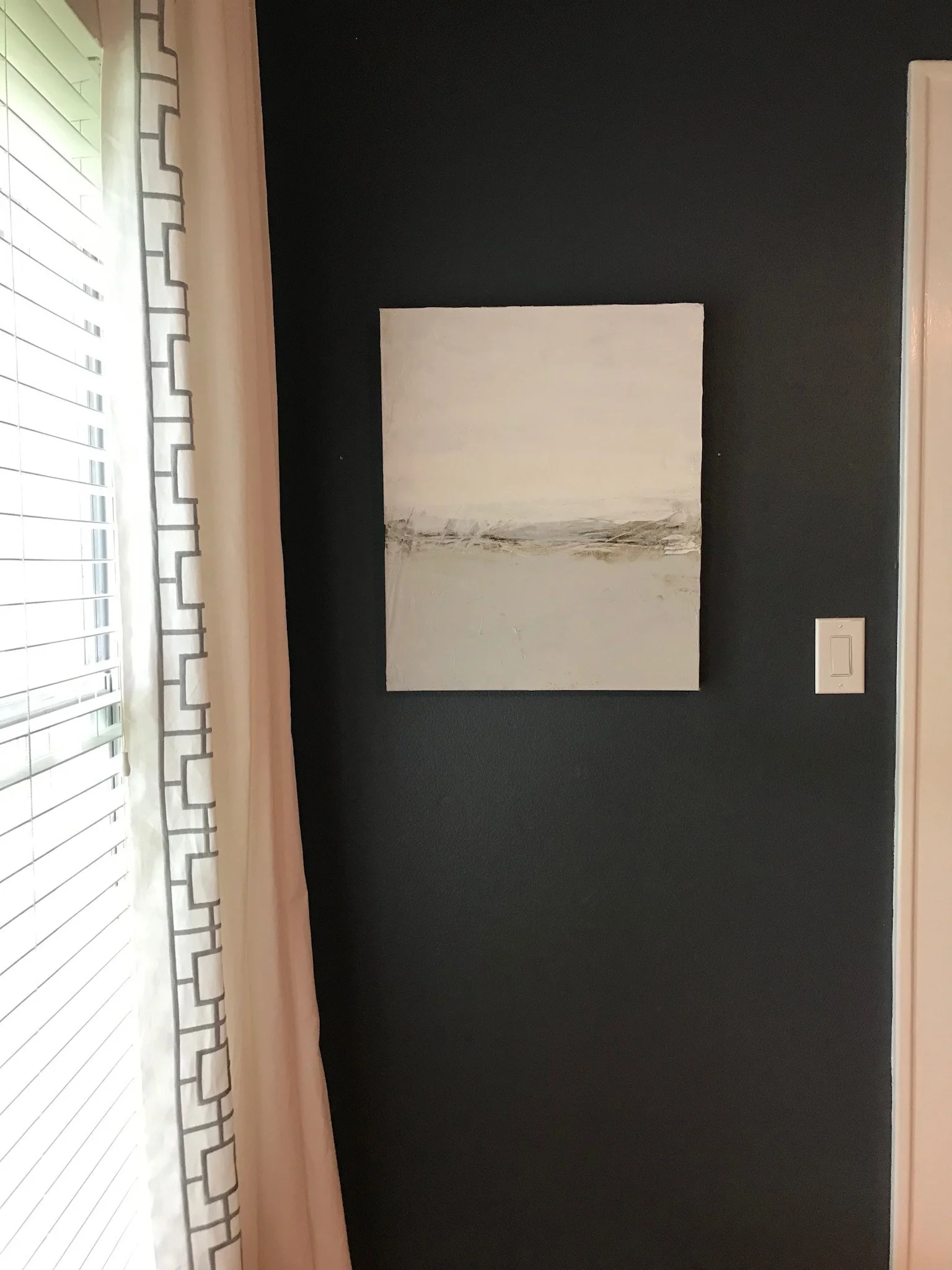 Neutral landscape wall art in blue and grey.