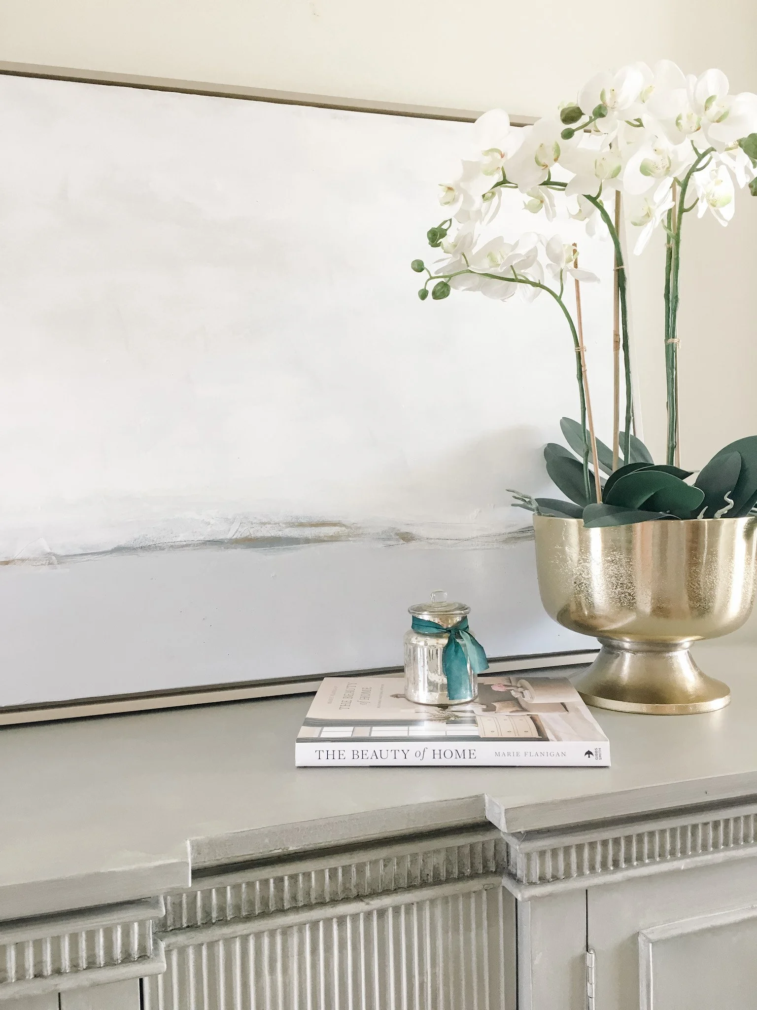 Large abstract painting for Interior design hangs over a desk.