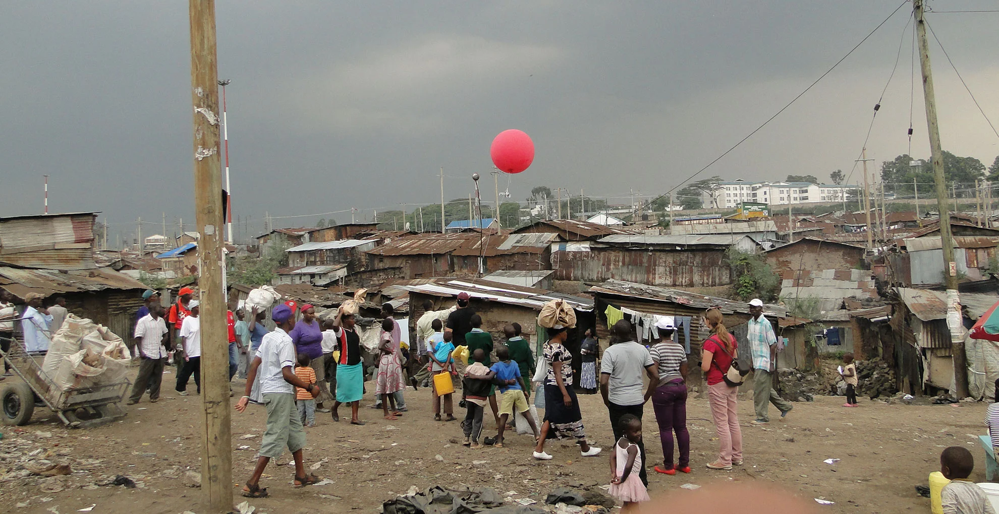 Researchers, Muungano members, and Mathare residents doing aerial balloon mapping.