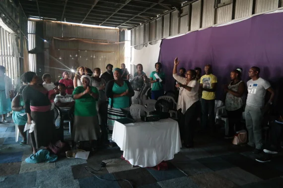 Alliance begins Cape Town partnership meeting in song in Bosasa Community Hall, Mfuleni