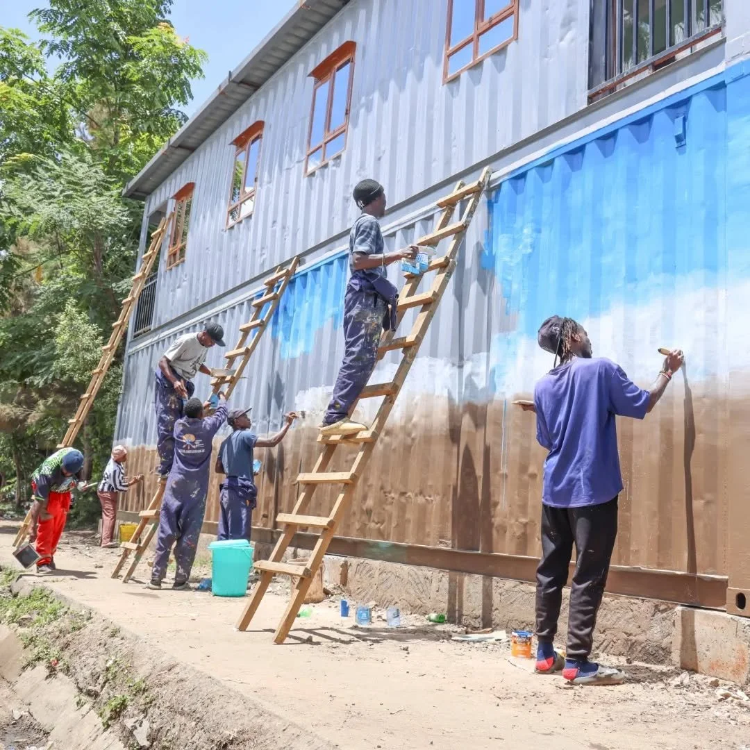 The Kiamaiko Resilience Hub is coming to life 🎨

Ahead of its launch on 10th April, youth from the community are already on the ground, painting and branding the space, turning it into a vibrant, people-centred hub for action and collaboration. This