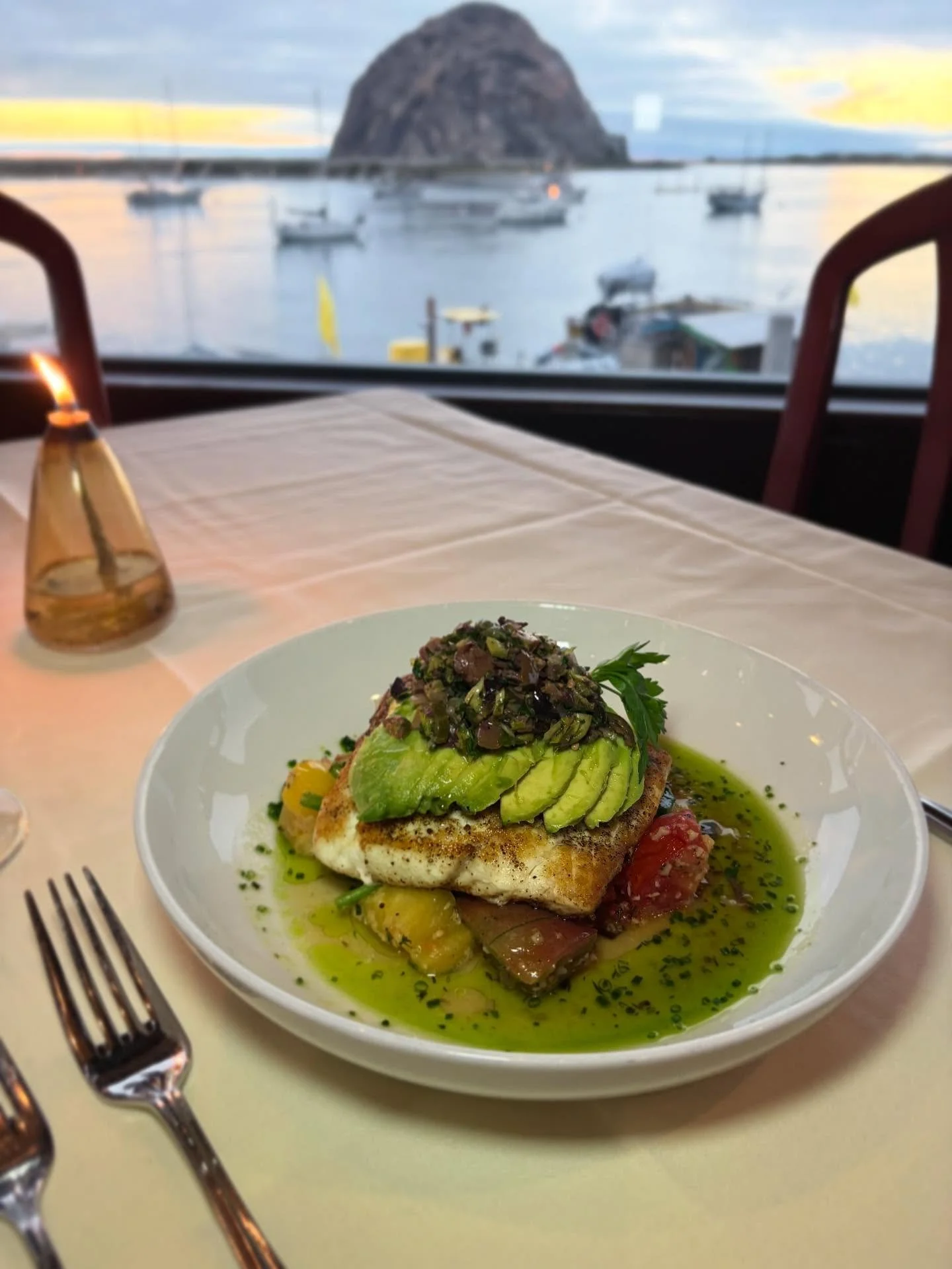 A guest favorite, Our local halibut is cooked to perfection and layered with vibrant flavors. It&rsquo;s served with stewed tomatoes wilted spinach, and topped with a savory prosciutto caponata and creamy avocado- each bite bursting with rich, satisf