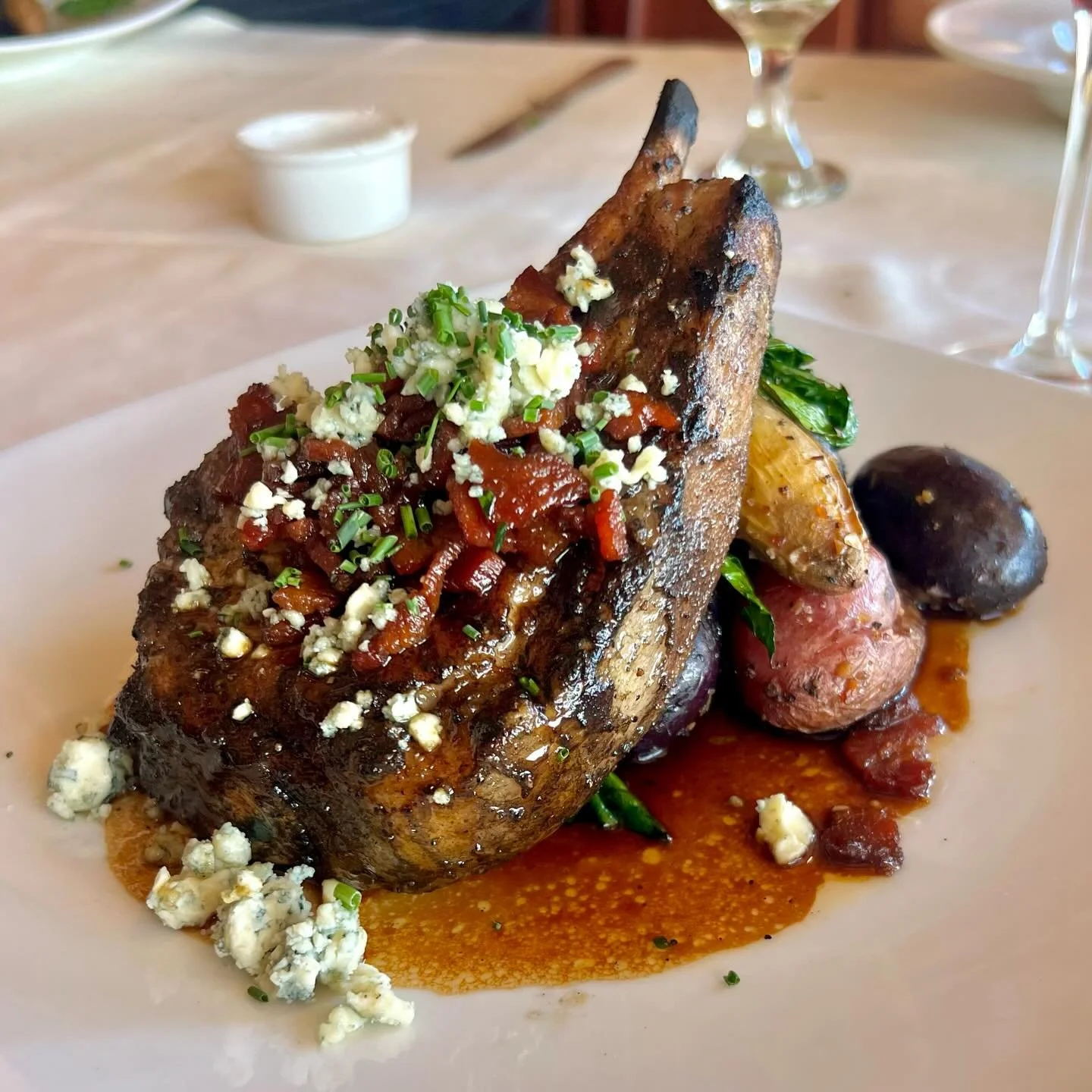 Our Pork Chop is back! Featuring Snake River Kurobuta Pork Chop served with roasted potatoes, wilted Tuscan Kale, Bacon Demi Gastrique, Stilton Bleu Cheese Crumbles, and Truffle Oil. A longtime favorite among our locals and guests,and one you won&rsq