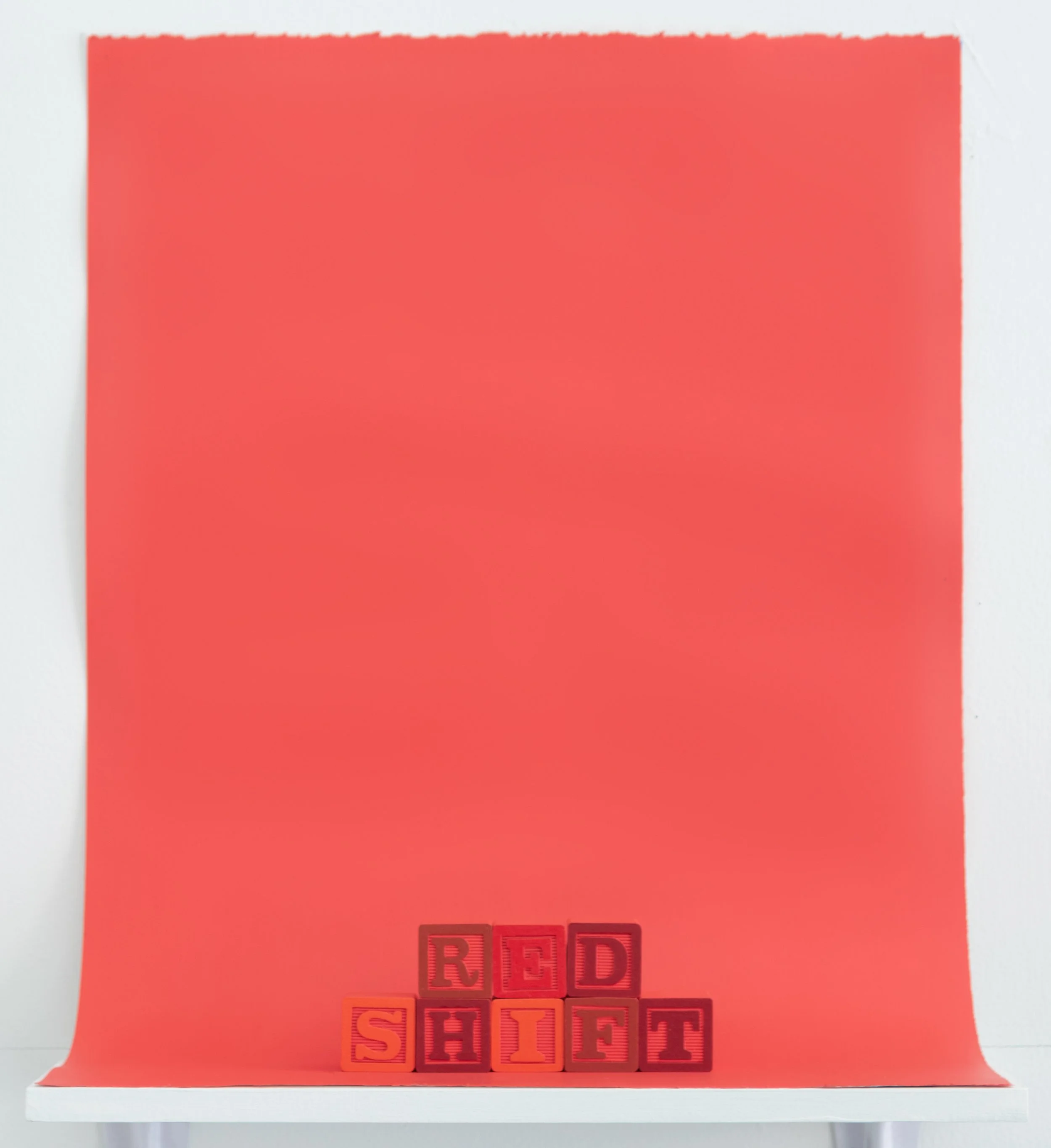 painted alphabet blocks spelling the word “Redshift”