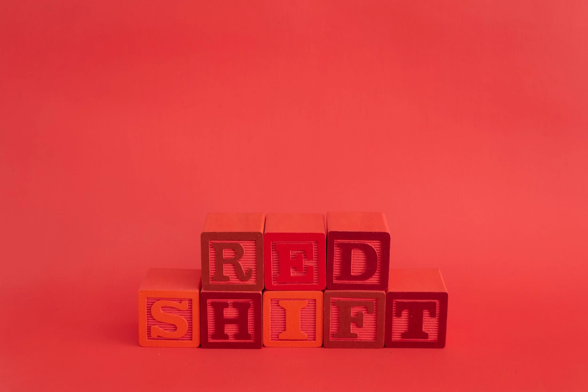 painted alphabet blocks spelling the word “redshift”