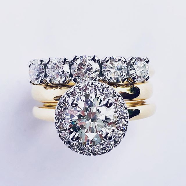 Engagement and eternity ring remodel. Original ring was a solitaire engagement ring. Eternity ring was a three stone. Now an amazing halo engagement ring with 5 stone eternity. A beautiful ring for a beautiful client. It has WOW factor  #diamondengag