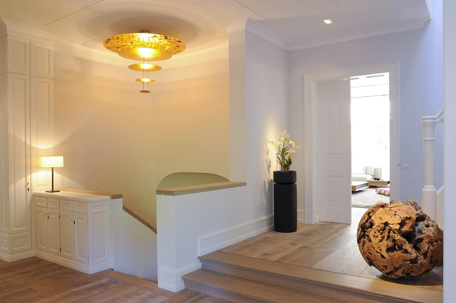 Location: Munich, Germany Partners: plug lighting, los angeles & graf maltzan architects, munich, brantner holzmanufaktur Practices: interior, furniture, lighting This project is an example of the harmonious fusion of traditional classical architecture and contemporary interior and lighting design. The client’s wish was to create the cozy feeling of a traditional villa designed in the style typical for flourishing Munich in the late 1800’s. The challenge centered around the best ways to seamlessly combine the intimate energy of the home with a high tech underground parking, a vast private spa and state-of-the-art technology, home automation, lighting and contemporary interior design. As the integration of these specific wishes into an existing structure seemed unobtainable, the client decided to build a house from scratch and commissioned renown Munich based Architect Graf Carlos Maltzan to design the house’s exterior, Michael Neumayr with the interior architecture and Pia DeLeon of Plug-Lighting, Los Angeles with the lighting of this 1300qm | 14.000sqft private residence.This 5 story residence features 2 underground floors, with a footprint 25% larger than the above ground structure, to accommodate a private Spa with a large swimming pool and private gym area stretched out over an area of 306qm | 3300sqft on the 1st underground floor. The 2nd underground floor houses a 2 car garage with a 2 car elevator, a personal elevator, several technical rooms as well as a 70qm | 750sqft kid’s playroom. The kitchen, dining room, living room, billiard room and study are located on the ground level. The upper level features kid’s and guest rooms. The master suite and office are located on the top-level. Every architectural detail, every built-in, the lighting and furniture even the accessories and the art work was curated, designed or specifically developed for this project