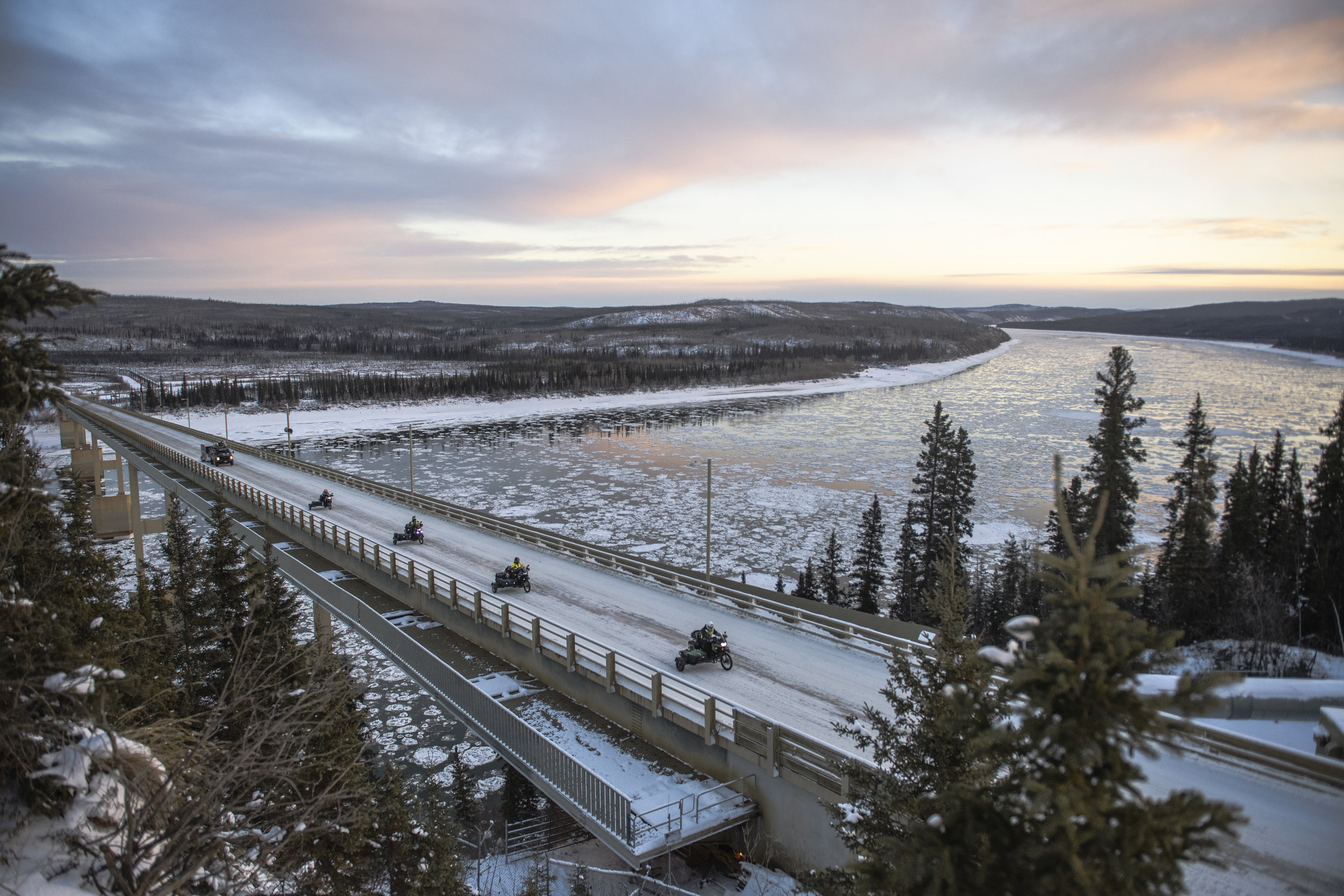 The riders crossing the Yukon River near Yukon River Camp, Alaska.