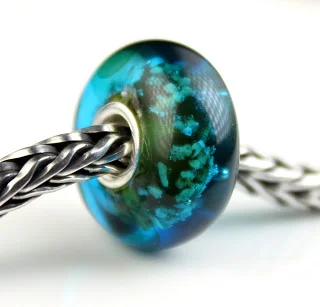 Shaded turquoise glass encasement