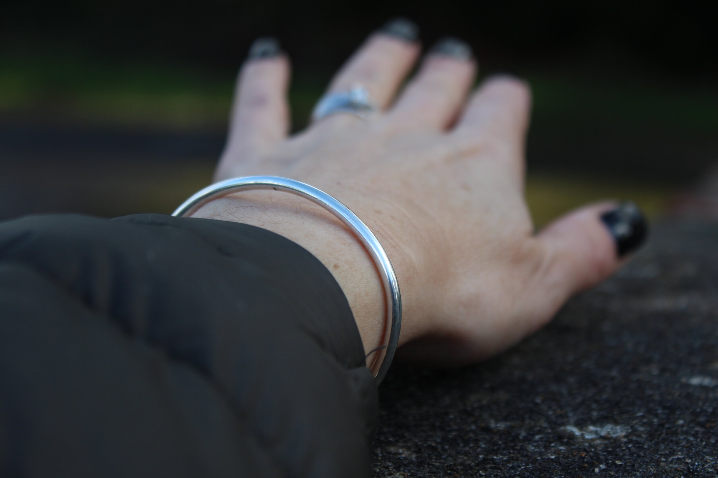 Handmade sterling silver charm bangle