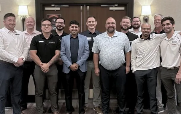 Emerging Leader Development Graduates Posing for Picture. 15 Employees.