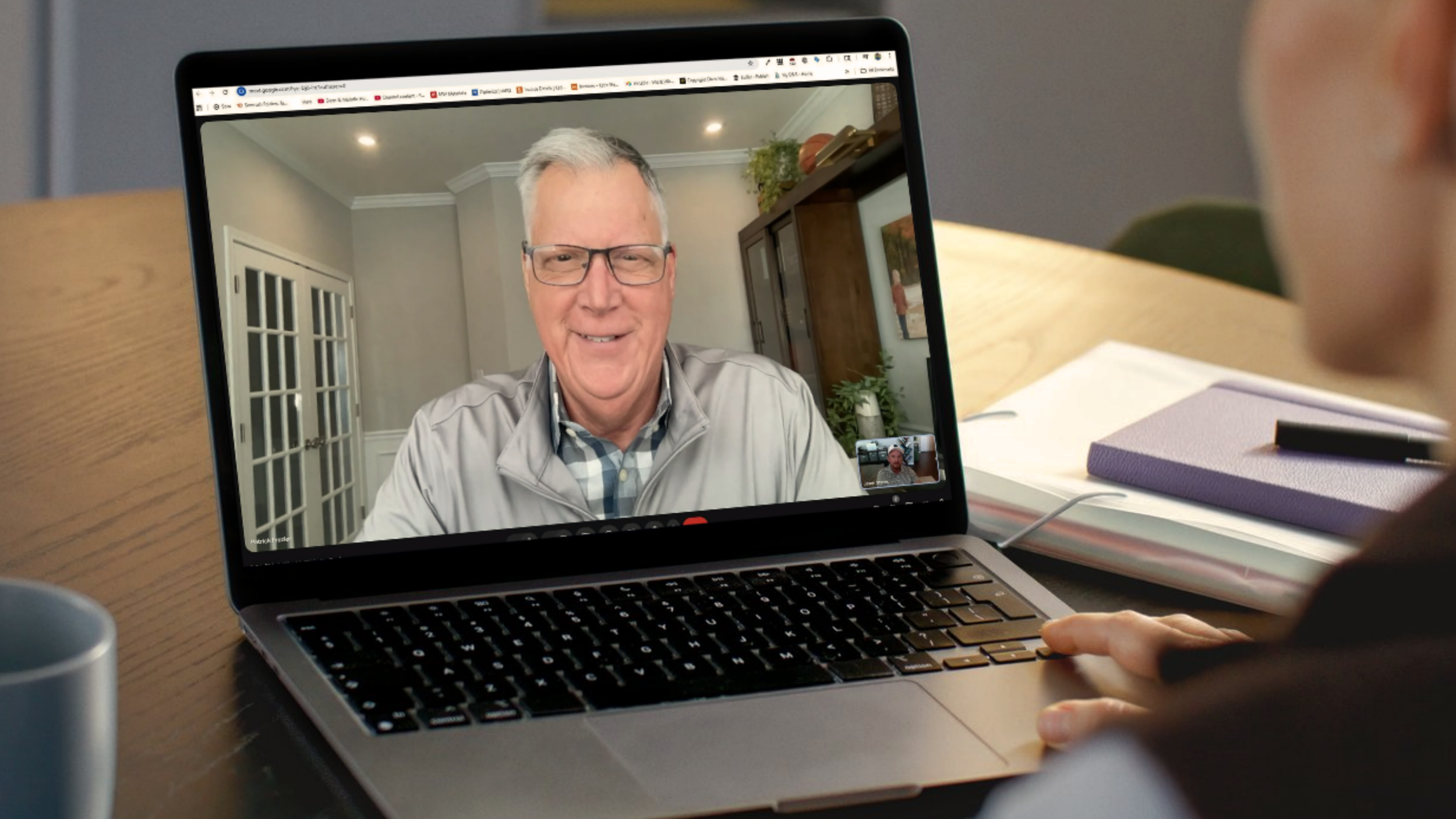 A person is participating in a video call with Pat Frazier on a laptop
