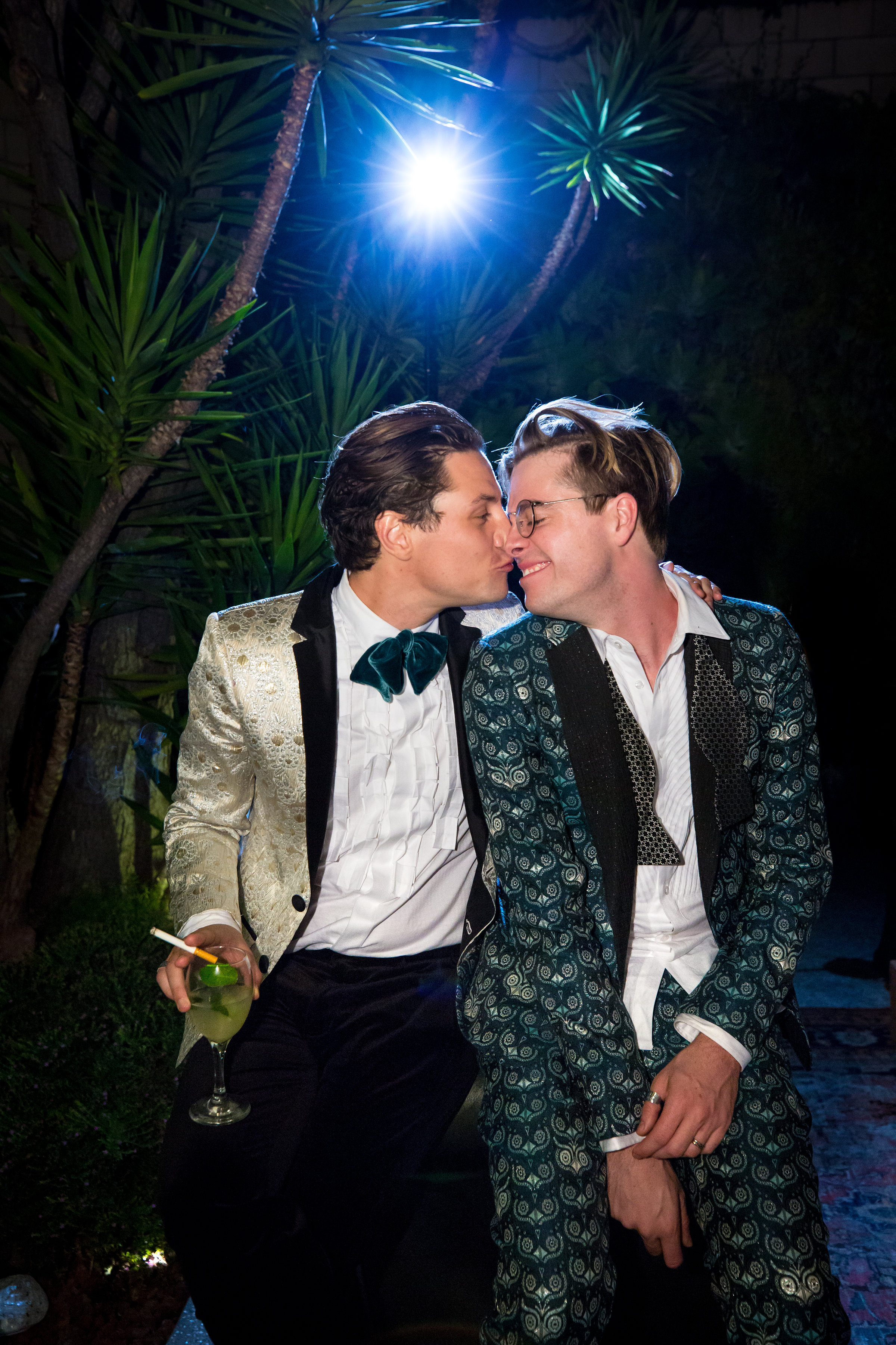 View the Full Gallery Here Venue: Smog Shoppe Photographer: David Perlman Photography Suits: Mr Turk Grooming: Jonathan Van Ness Officiant: Eric Gilliland Flowers: Georgiana Louella Johnson & Alexis Krause Di Salvo Catering: Border Grill & Night Market Thai Rentals: Town and Country Cake: Cake & Ar t Artwork: Somerset Sidney Prew DJ: Micah James Witchcraft: Miguel Pinzon Video: Jake Wilson