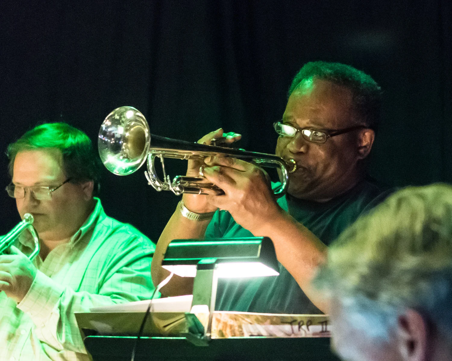 Trumpet player Allen Johnson plays a solo during The Parkside Reunion Big Band’s bi-weekly performance April 4 at McAuliffe’s Pub. Throughout his lifetime Johnson has played with famed jazz performers such as pianist Count Basie and Maynard Ferguson. 