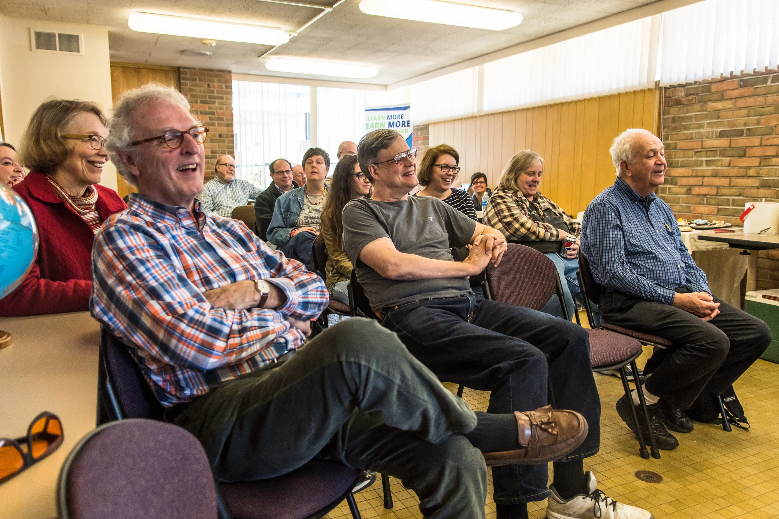 Guests laugh during readings and stories during the Racine Literary Council's celebration for Shakespeare’s Birthday on Sunday.