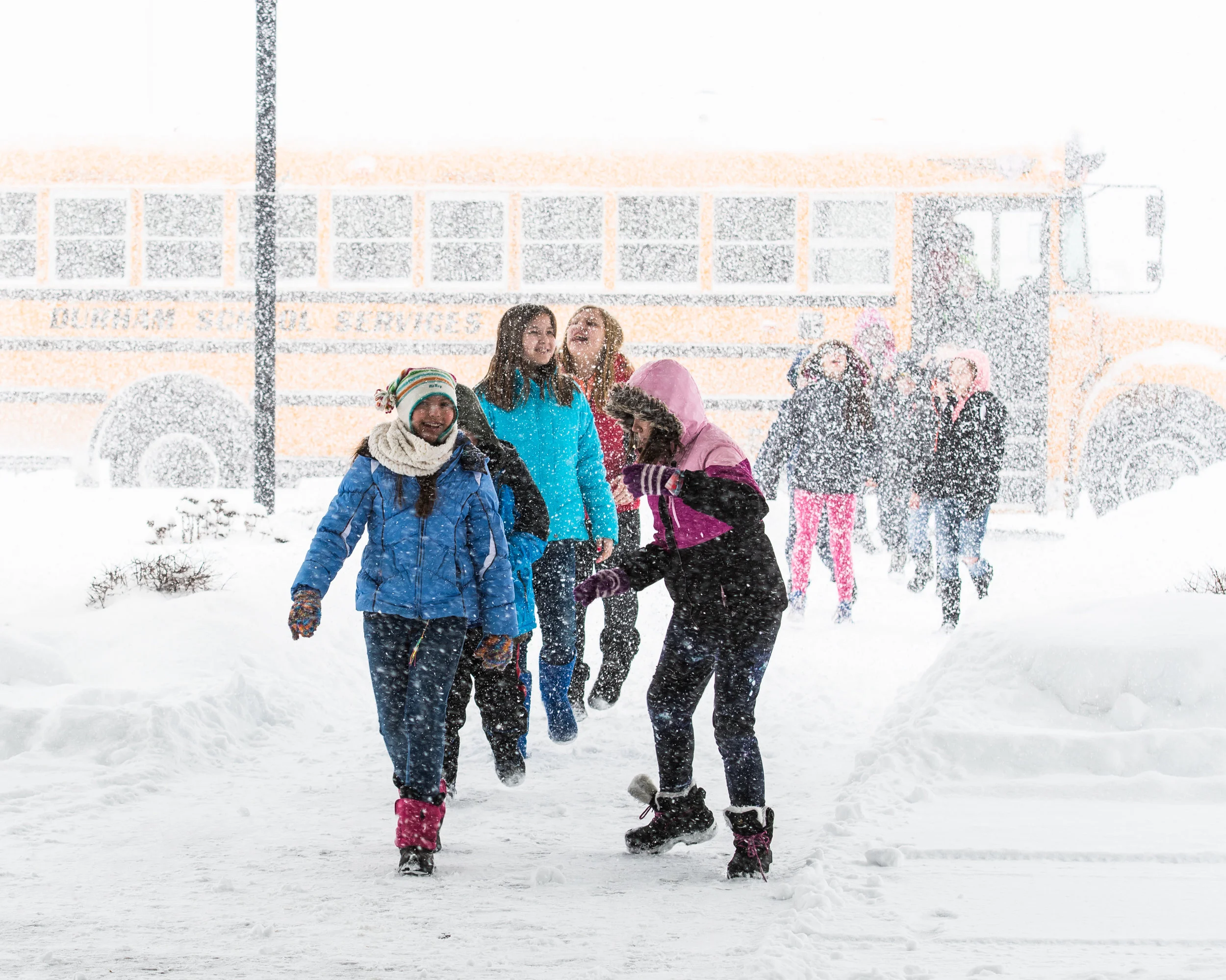 Fifth graders from Olympia Brown Elementary brave the morning winter gusts as they enter Grace Church for the Racine Symphony Orchestra Concert.