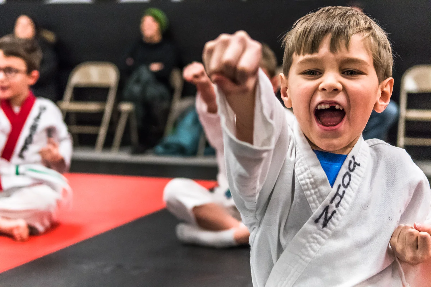 John Borgardt, 6, Racine, performs practice punches with his Little Dragons karate class at Black Belt Karate in downtown Racine Friday night.
