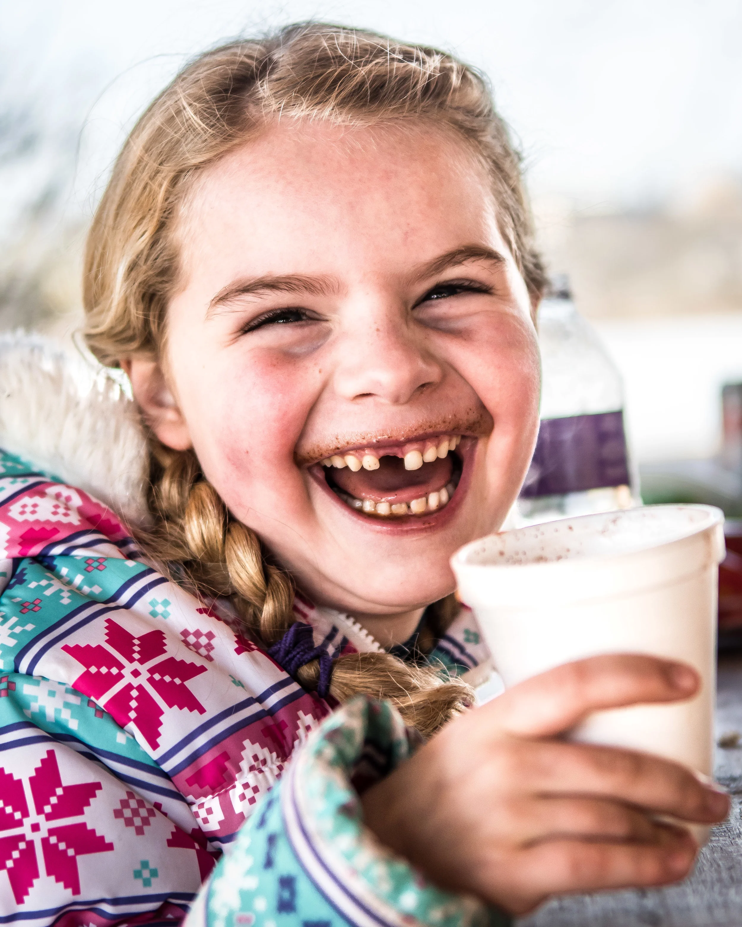 All smiles - Elizabeth Kordus, 6, shows her missing front tooth with a hot chocolate mustache while enjoying her hot chocolate during Burlington’s Hot Chocolatefest Saturday afternoon.