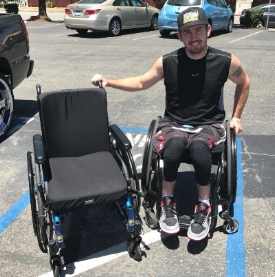 Troy receiving the Motion Composites Helio C2 wheelchair