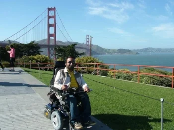 Srin posing across from the Golden Gate Bridge