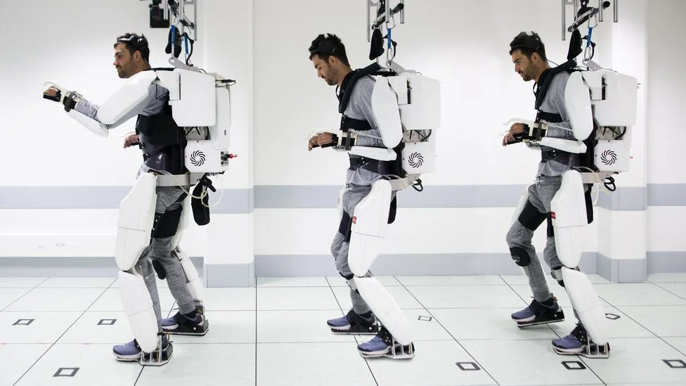 When he thinks "walk", it sets off a chain of movements in the robotic suit that move his legs forward.