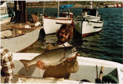 Here's a younger, slimmer, hairier Tim circa 1986. Behind him is the "Edgy" which was Tim and Margaret's first crab boat and the sailboat Whereaway which was their home for nine primitive years . Built in 1933 Edgy was originally a Japanese gillnetter. Note the Songhees shoreline in the back ground, devoid of the current condos and complete with Seaspan chip barges.