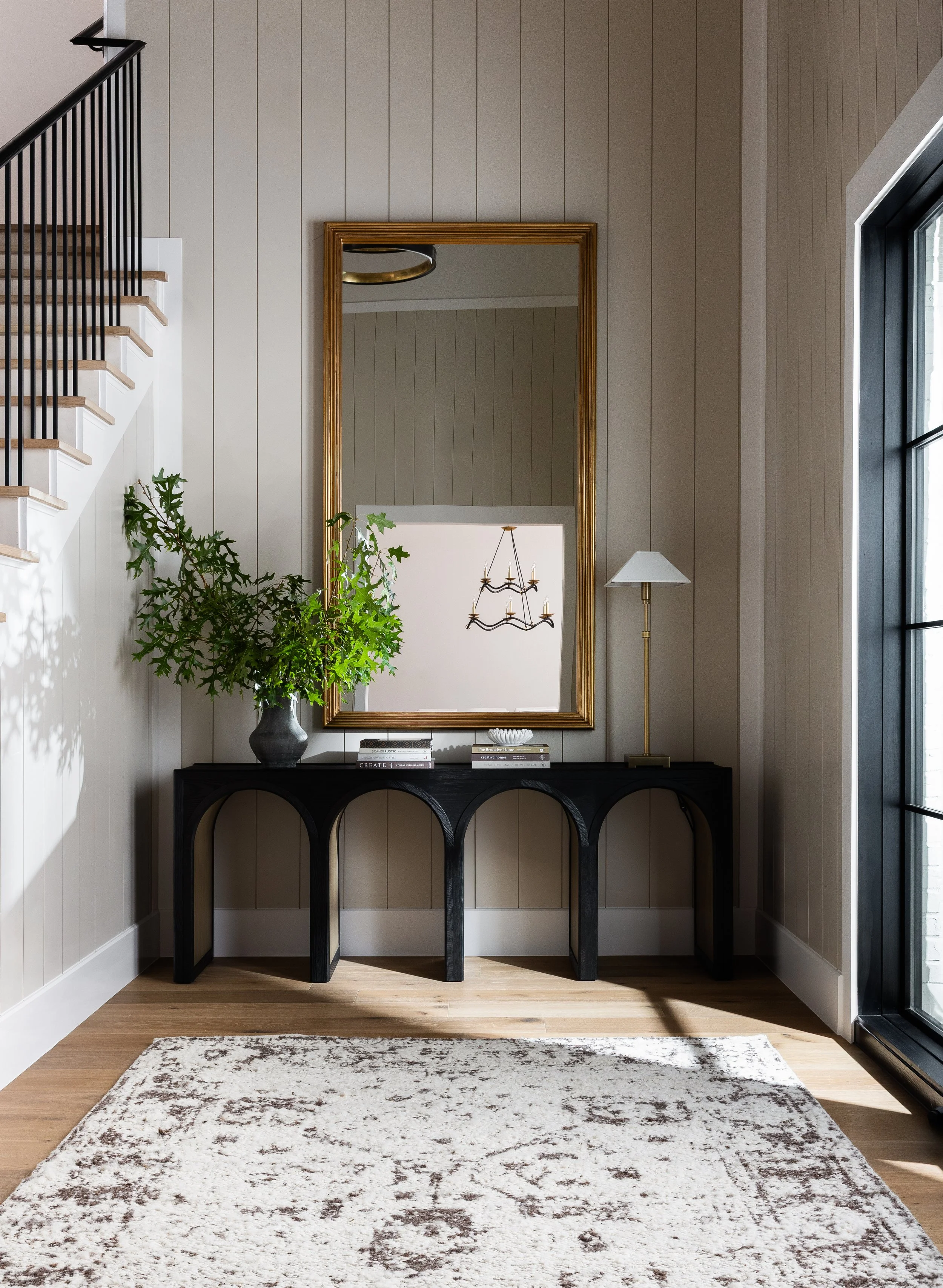 Green stems in large entry; interior design photographer Dallas