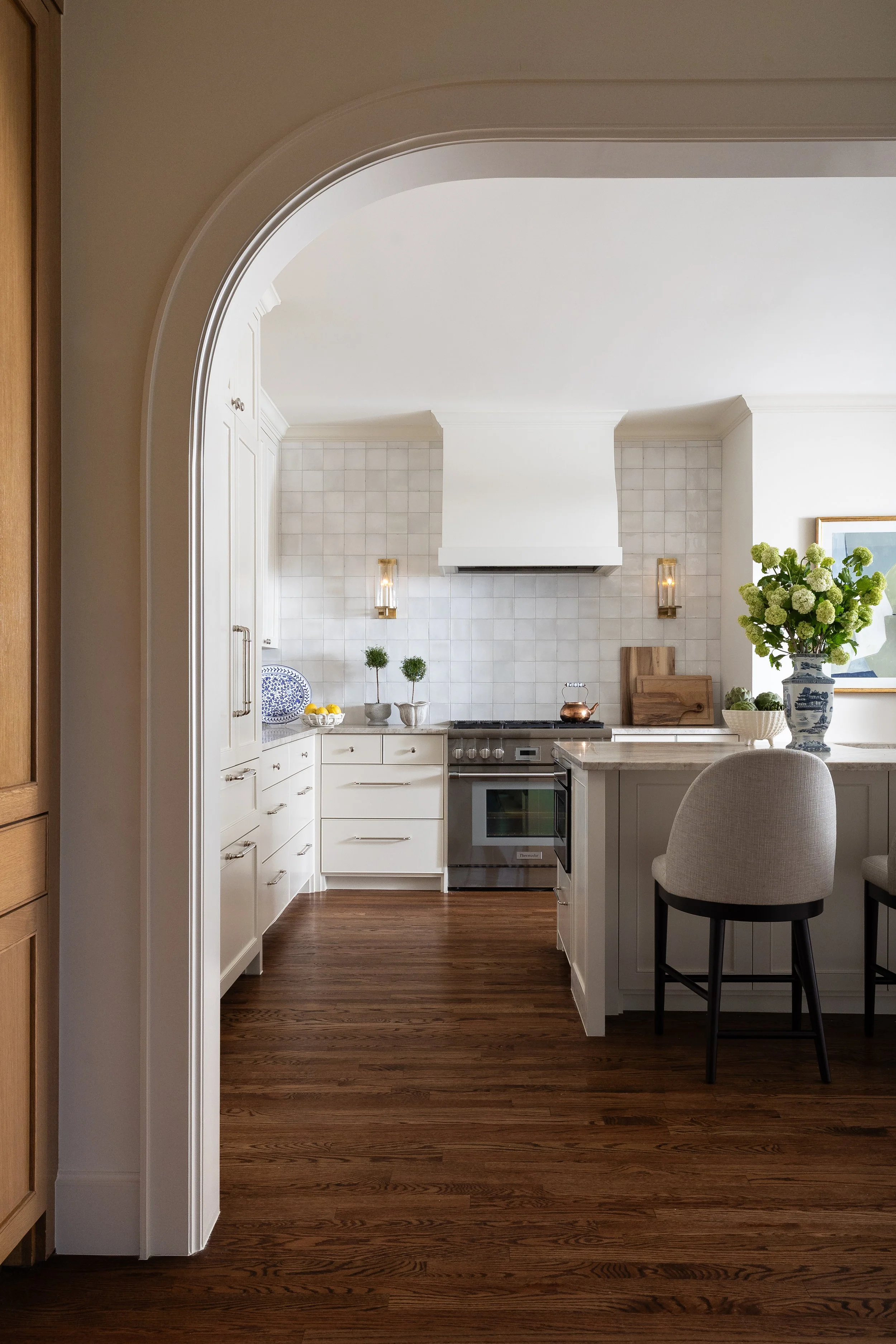 Arch casting into kitchen, real estate photography vs interior design photography