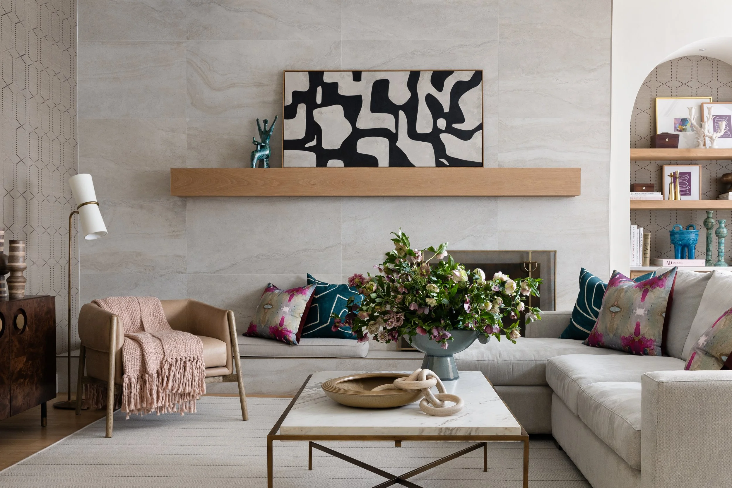 Laura Park jewel toned pillows in new traditional living room