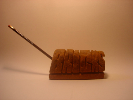 Sandstone pencil holder, Mr. Imagination, 1992.  The artist made this for me on the occasion of the publication of my first book,     BRICKS: A New Book of Poetry
